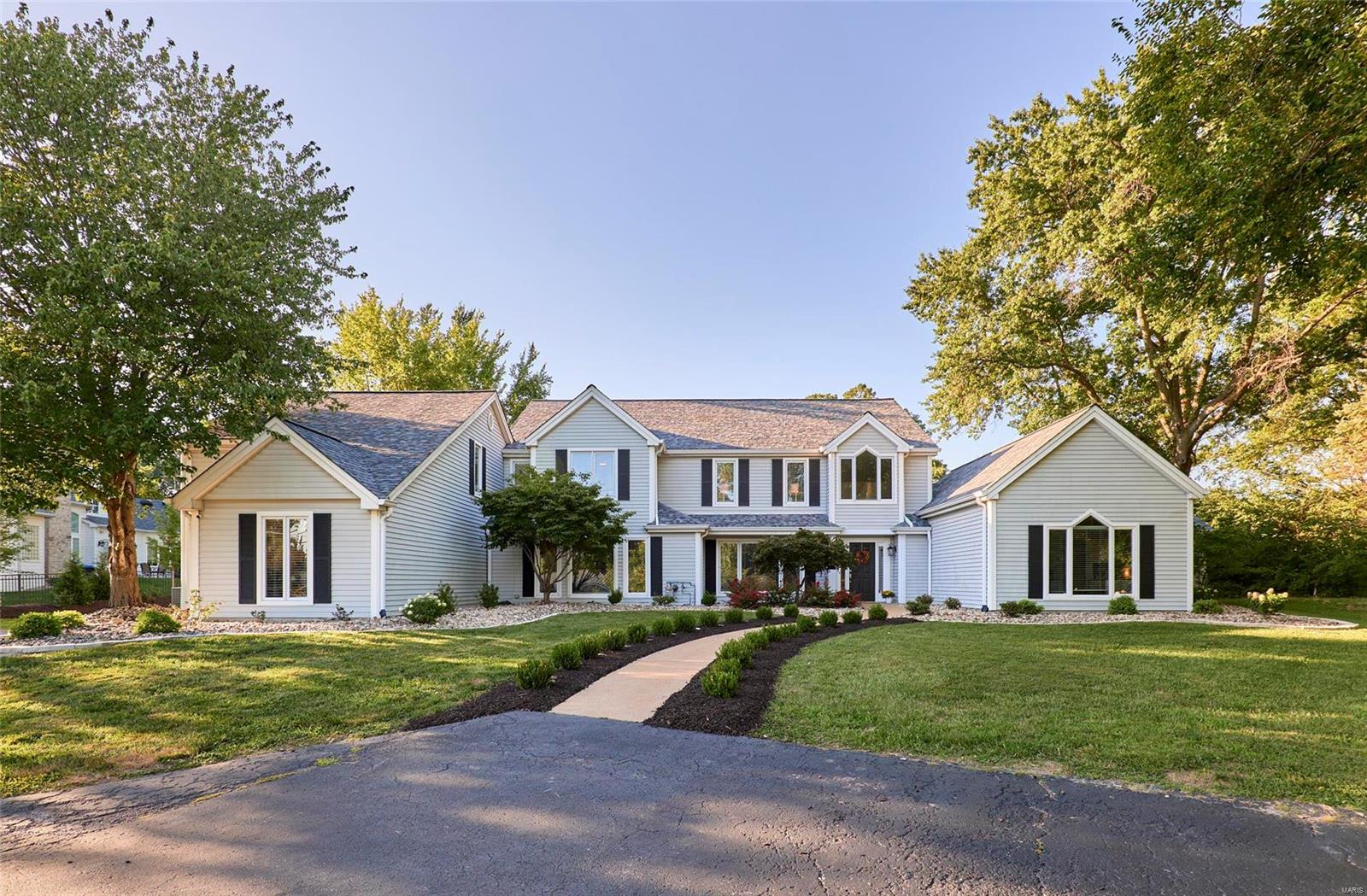 Dramatic contemporary home sitting on a private 1 acre lot with inground pool.  4 Bedroom, 4 ba home with 2-story entry with slate floor and vaulted great room with a wall of windows overlooking the pool, patio and large private lot!  The decor of this beautifully appointed home is neutral and can be transformed to anyones palate.  The huge gourmet kitchen has 12' ceiling, walk-in pantry, stainless steel appliances including a Sub-Zero fridge, dishwasher, trash compactor, range hood, range/oven, icemaker and wine cooler and cabinets galore. Jack and Jill bath between the 2 upstairs bedrooms and a huge rec/media room.  Mstr with newer ceramic tile, 2 walk in closets, double sinks, soaking tub and large shower and an office just off the mstr.  Additional b/r, powder room and laundry round out the main floor.  You'll be entertaining family and friends outside with a large patio and pool. The hot tub is negotiable.