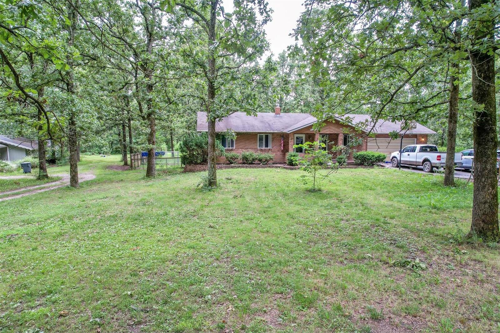 YOU WILL LOVE THE QUIET SETTING OF THIS 2,500 SQ FT HOUSE NESTLED IN A WOODED 1 ACRE LOT!! Located in a cul-de-sac & just minutes from the amenities of town. The main level consists of 3 bedrooms, a spacious living room, kitchen, dining, and laundry area. The basement has a bedroom and family room, a media room/game room, and a storage area. The yard has an above-ground pool for the hot summer days, a fenced back yard, and a deck to relax at the end of the day. The deck faces a view of the wooded/open, peaceful lot. Some updates in the house including a freshly painted kitchen wall and dining too, newer quality laminate flooring in the living room, hallway, and newer carpet in 3 of the bedrooms. Work from home with ease with the excellent internet coverage. About 2,500 sq ft of living space is waiting here for you to become the new homeowner! Additional Rooms: Mud Room