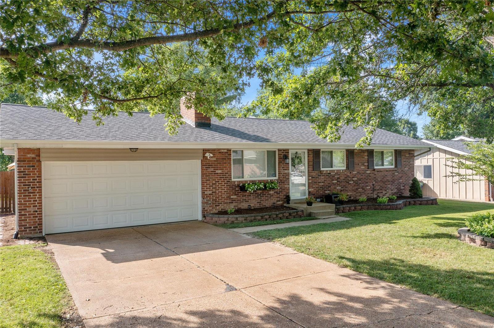 Charming ranch home!! You'll fall in love the minute you walk in thanks in part to the open floor plan, wood floors, wood-burning fireplace in the living room flanked by built-in shelving, separate dining room, a chef-worthy kitchen with granite countertops, stainless appliances, backsplash, breakfast bar and pantry. The divided bedroom floor plan allows for privacy with the master including his and hers closet and the secondary bedrooms both are generously sized. The basement is tastefully finished with a large recreation room, full bathroom, and plenty of storage. Flat, functional & fenced backyard enjoys a wraparound covered deck, built-in fire pit and a new 25 x 20 patio. Perhaps the best features are the updates including water heater, HVAC, roof, windows, bathrooms, 6-panel doors, recessed lighting, and gutters. Possessing a 2-car garage also makes this home unique. 1-Year HSA Home Warranty is included for your piece of mind. Schedule your appointment today!