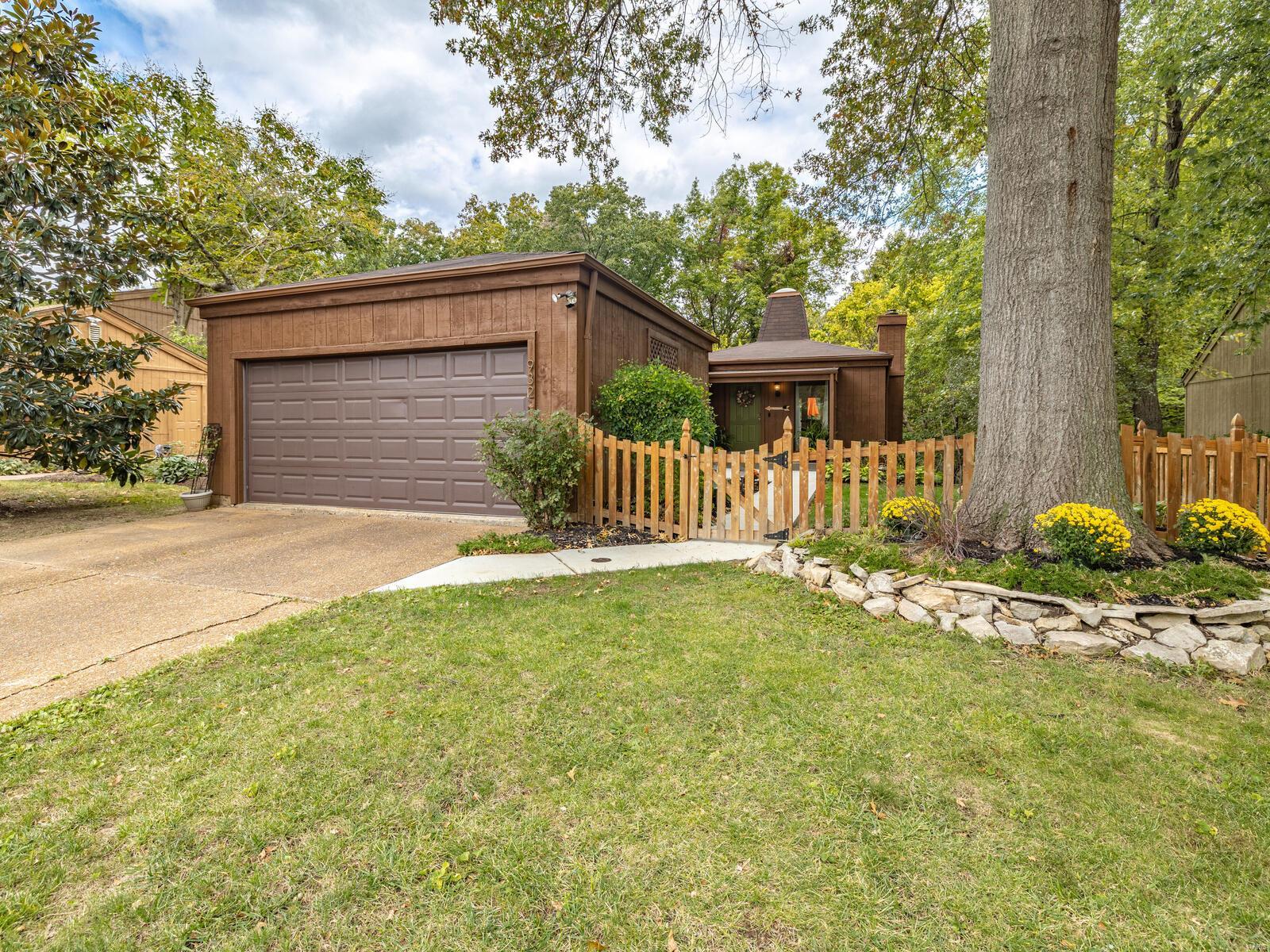 Welcome home to this stunning ranch on a wonderfully quiet street in the highly-desired Country Lane Woods II subdivision! This home welcomes you with an idyllic front garden, fenced (2018) in to ensure privacy and enhance curb appeal, that acts as just the start to your personal oasis. As you walk in on the newer hardwood floors (2015), you're bathed in natural light that ushers you toward your updated kitchen (2018-2020), and out to the top of your double deck to enjoy some of the most quiet, wooded privacy that money can buy in West St. Louis County. Other updates include roof (2020), electric box (2020), porch and sidewalks (2020), flooring (2020) and beyond! Act fast - homes like this do NOT last!
