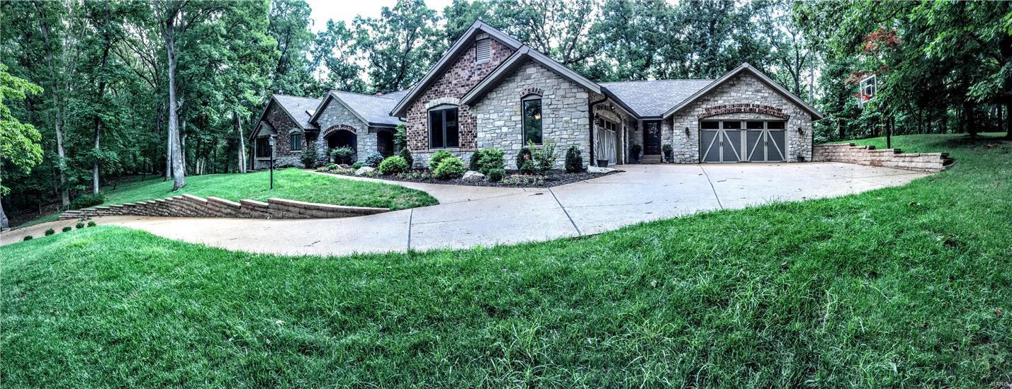 This is an incredible total rehab on the privacy of acreage with all the new features - Predominately tasteful blend of  brick and stone -A gracious front porch with an entry that blends so seamlessly with the great room - and into dining room adjoined by the breakfast area for the entertaining feature of a huge dinner party or separation - with floors blending - The kitchen is breathtaking with huge island, custom refrigerator/with separate freezer - Master and one additional bedroom on the main floor - with the separation for teens or quests of family/rec room - media space and exercise room - Fireplace is all the spaces that need them - Bedrooms in the lower level are exceptionally large and private - of course a private bath - updated  with tile to please any young adult or teen - The kitchen has a walk in pantry and a custom fitted hallway for the busy family - coat storage and book/sport lockers - the laundry is really ready - a dog bathing facility for a family pet 4+ car garage Additional Rooms: Mud Room