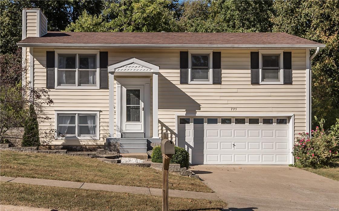 Beautifully updated Valley Park home with 3bd/2bth in Crescent Woods subdivision. The entry foyer welcomes you up to the main level which features spacious living and dining room areas, cathedral ceilings, canned lighting and gleaming hardwood floors throughout. The stylish kitchen offers ceramic floors and backsplash. Just off the back door, you’ll find the massive 19X18 wooden deck with gazebo. The private yard backs to trees and is the perfect place for quiet living or entertaining. The updated hall bathroom has a private door into the master bedroom, porcelain tile, oversized vanity, and shower with beautiful glass tile detailing. Lower level features a gas fireplace, flexible floorplan, plus another fully updated bathroom. Oversized garage gives you space for 2 vehicles and a storage/workshop area. Refrigerator, washer, and dryer are included.