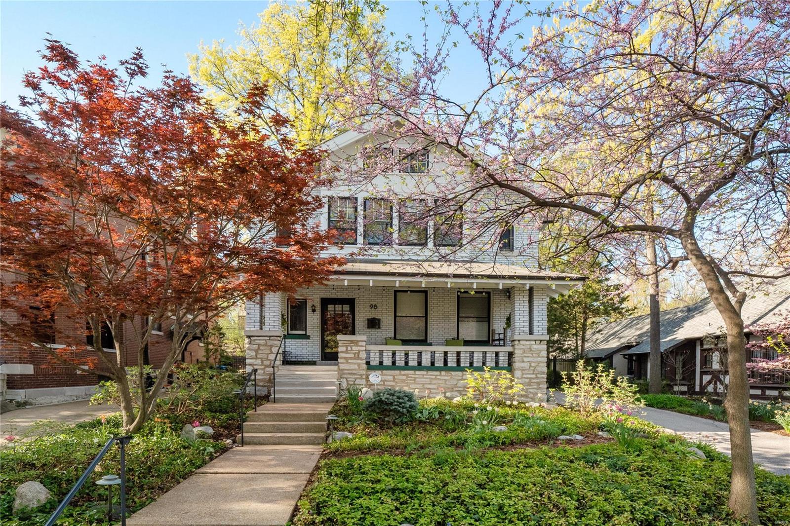 Spring is the ideal time to discover this enchanting century-old home nestled in the enviable, upmarket Hillcrest neighborhood. Fragrant flower beds and a blossoming canopy provide a welcoming entry, complementing the home’s attractive brick and stone facade. Flawlessly remodeled, it is respectful of its heritage yet offers all the mod-cons. Admire the warmth of timber in lustrous floors, windows, stairways & doors. Stained glass windows provide color and character. Bedrooms are opulent, light-filled and airy, the primary has a vaulted ceiling and large windows overlooking a lovely landscaped yard. Luxe bathrooms and an ultra modern kitchen are also standouts. Outside is a south-facing deck perfect for alfresco dining. Nearby, Forest Park, historic DeMun, U. City & Delmar Loop offer endless entertainment, dining & shopping options. Walk to acclaimed schools and Washington Uni. Offered for the first time in 30 years, spring into action to secure this captivating home.