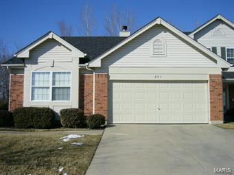 Back on the market, buyer's financing fell through.  Ready to downsize without losing quality or convenience?  This is your new home.  Better yet, it's Wentzville schools.  The first thing you'll notice when you walk in will be the beautiful wood floors leading you right to the fireplace.  Go into the kitchen/dining area, with ceramic tile, and you'll see custom cabinets and a pantry.  All the colors just say "I'm home".  The master bedroom suite has a large walk-in closet and the bath has a separate tub and shower.  The baths are loaded with custom tile work.  Every detail has been attended to and maintained in this home.  The main level also has the laundry, another good-sized bedroom and another full bath.  The lower level has a fantastic rec room with a wet bar with dry-stack stone walls and granite counters.  The rec room also has a theater section with surround sound.  There is also a full bath in the lower level and a sleeping room.  The oversized garage is drywalled. Additional Rooms: Workshop/Hobby Area Location: End Unit, Ground Level