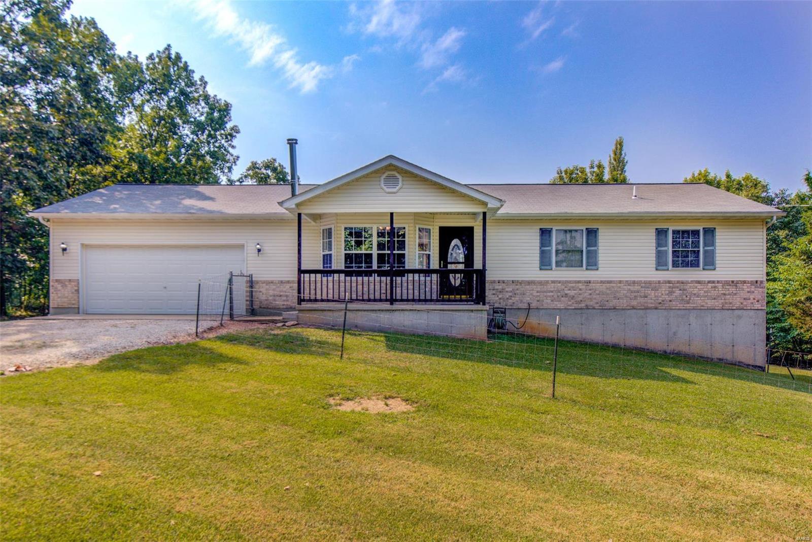 Tucked away at the end of a quiet cul-de-sac you will find this 3 bed 3 full bath home sitting on 3.18 acres of land. You will be greeted by vaulted ceilings when you walk in the family room with bay and wood burning fireplace. The engineered hardwoods lead you into the dining area with bay and access to the huge deck. The kitchen has granite counters and spacious center island. The primary bedroom with walk in closet bay and ensuite are on the main level with access to deck along with the second bed and bath. Main floor laundry finishes the upstairs. Downstairs you will find a spacious family room 3rd full bath and bedroom with walk in closet. Also downstairs there is potential for 4th bed and a huge storage area. Outside you will find 3.18 acres of flat land with many trees being cleared away. Also on the property is a second one car garage perfect for hobbies and extra storage. For those off-road enthusiast less than 30 minutes from Pruitt Mountain and Moonlight both off-road parks.