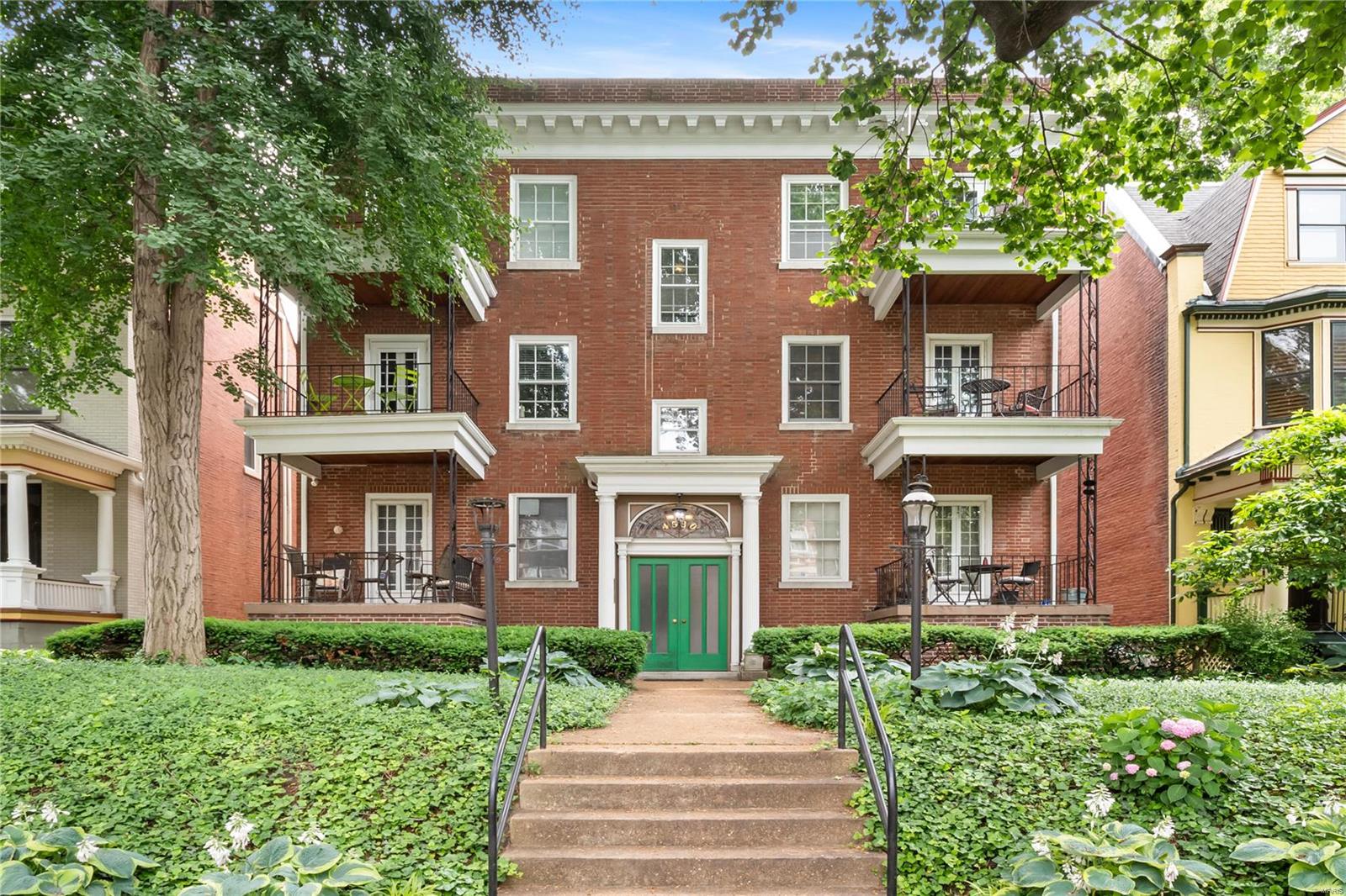 Located in the heart of central west end, 4530 McPherson rests on a quiet block a short walk from Hospitals, Universities and Forest Park - plus your favorite cafés, boutiques, and grocers! Boasting a beautiful brick exterior, a wonderful courtyard, and convenient off-street parking, this complex has everything you seek! Unit 2E is in a league of its own! The impeccably maintained original hardwood floors, and stunning wood trim set the scene for the wonderfully spacious living and dining rooms! Beyond the living room, rests the serene front porch balcony - perfect for your morning coffee. The flow of the unit is notable as you follow the hallway past the first full bathroom and in-unit laundry room to the eat-in kitchen - offering plenty of space to cook and dine. Beyond the kitchen, the spacious primary bedroom features ample closet space and easy access to the second full bathroom! Finally, the second bedroom opens up to a breathtaking sunroom and overlooks the beautiful courtyard! Location: Corner Location, End Unit