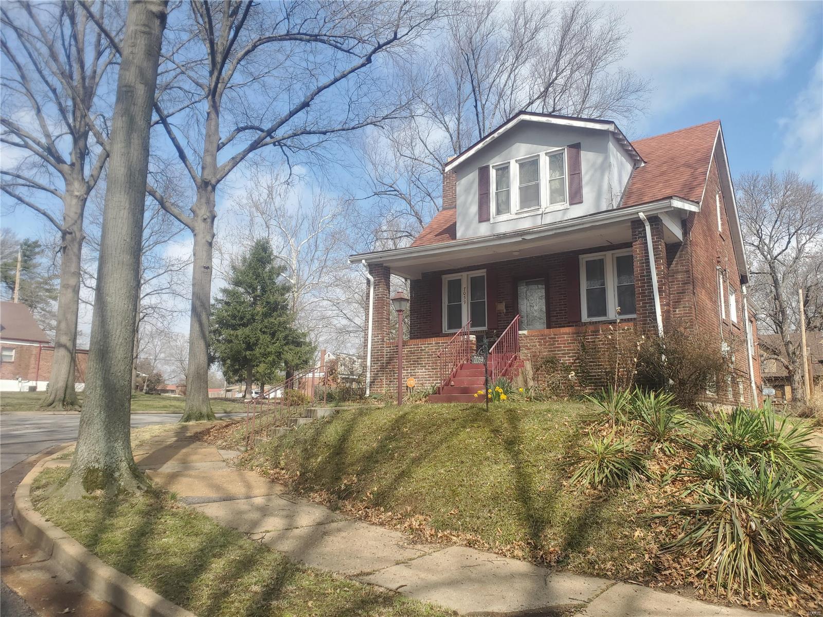 Come take a look at this beautiful, all brick, 2 story, fixer-upper home with tons of potential! Complete with 3 bedrooms, 2 bathrooms, hardwood floors and PLENTY of off street parking! The lot next door at 7057 will also be included with purchase at no additional cost! This home is filled with endless possibilities and enough space for any updates you can imagine! Amazing school district. Near U city loop, Heman park and dog park. Schedule your viewing today! As is sale.