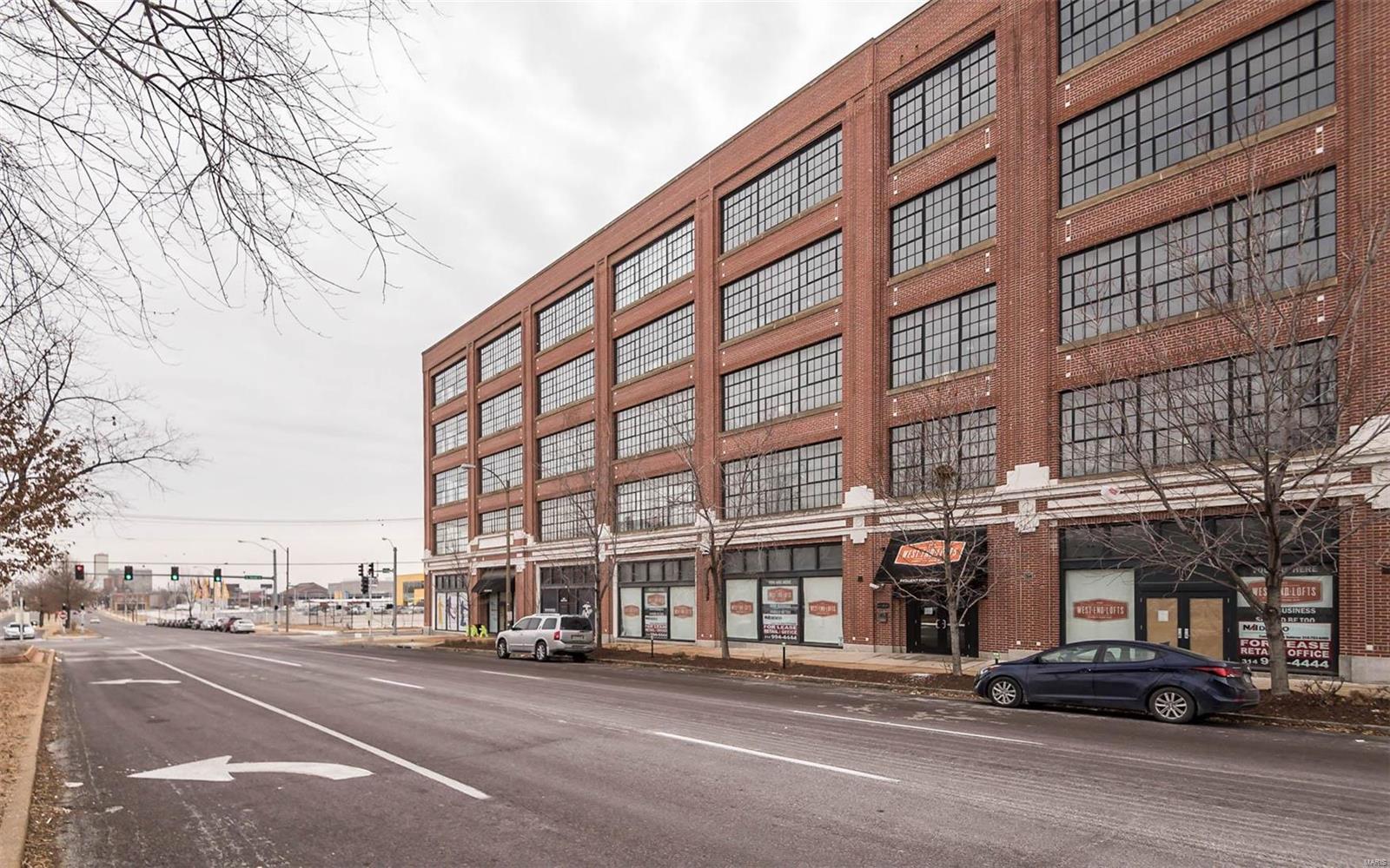 Nestled in an old Model T factory, this beautiful fourth floor loft possesses a north facing wall of windows, filling the living space with natural light. You will enjoy chic, urban living with a gas fireplace, hardwood floors, designer kitchen with Pedini Italian cabinetry, and amazing master bath with separate walk-in shower and 6 foot soaking tub. Two walk-in closets, in-loft washer/dryer, built-in shelving, storage space and covered parking seal the deal! West End Lofts is a lifestyle building filled with all of the necessary amenitites you desire... from large outdoor swimming pool, high-end fitness center & billiards room, to guest suite & dog amenitites. All located in a vibrant Central West End location that is walking distance to restaurants, cafes, BJC Hospital & Cortex District! Welcome home! Location: City, Upper Level