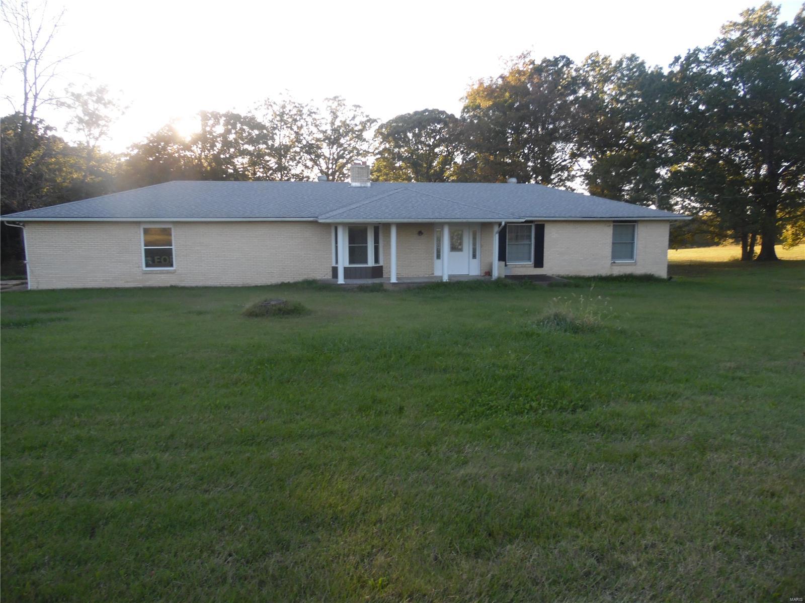 1500 Sq ft  3 bedroom 2 Bath ranch.Brick on 3 sides,10X16 Deck--Covered front porch 25x25 attached garage,24x36 detached with concrete floor and electric.Sits on 16 acres,nice size lake/pond beautiful sitting House needs some TLC PRICE REFLECTS THAT.SELLER HAS NEVER LIVED ON THE PROPERTY!!!SELLER WILL DO NO REPAIRS-BEING SOLD AS IS WHERE IS-NO GUARANTEES EXPRESSED--INSPECTIONS ARE INFORMATIONAL USE ONLY!!!--AGENT IS RELATED TO THE SELLER---ALL SUPPLEMENTS MUST BE SIGNED AND PRESENTED BEFORE THE CONTACT WILL BE VIEWED BY THE SELLER.BASEMENT DOES LEAK AND HAS SOME CRACKS INTHE WALLS 
 THERE IS SOME TERMITE TUBES AND SOME DAMAGE DO NOT KNOW TO WHAT EXTENT I DON'T KNOW A SHINGLE ON THE GARAGE ROOF HAS SOME DAMAGE.Please use Special Sales Contract
