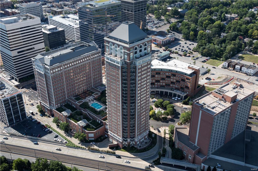 A pampered lifestyle of maximum luxury awaits, with panorama views from 2 balconies on the 9th Floor of The Plaza, Clayton's High Rise Condominium Residences, built to World Class Standards of Construction and Amenities. 2BD/3BA/2,421SF. #904, an end unit, directly overlooks the pool, gardens & walks. A foyer entry announces the expansive Living and Dining rooms. Master Suite w/room-size closet and luxurious bath. Directly off the master is a private office/den. The 2nd BR is en-suite, at opposite end of the unit, for optimum privacy. Separate laundry. The Plaza provides every appointment of comfort and convenience: Resident Valet parking, 24-hr Concierge Staff, on-site management, and modern Fitness Center. Resort extravagance engulfs the pool setting; park-like grounds, dog-walk, walking paths and grilling areas. The Ritz Carlton Hotel, exclusive boutique shopping, finest dining, casual eateries, Starbucks, banking, and more are only steps away. Location: End Unit