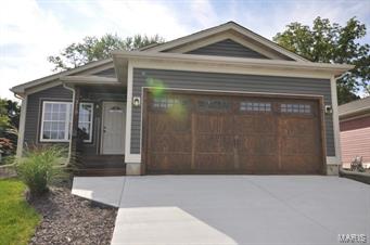 Adorable 2 bed 2 bath ranch loaded with updates and options including the vaulted great room, 42' dark maple cabinetry, 1/2 inch hickory wood flooring, MFL, 2 panel doors, upgraded vanity, open stair case to finished lower level with family room, rec room, office area, bath and lookout window with walk up ladder, Oversized one car garage, nice deck and yard with privacy fencing.