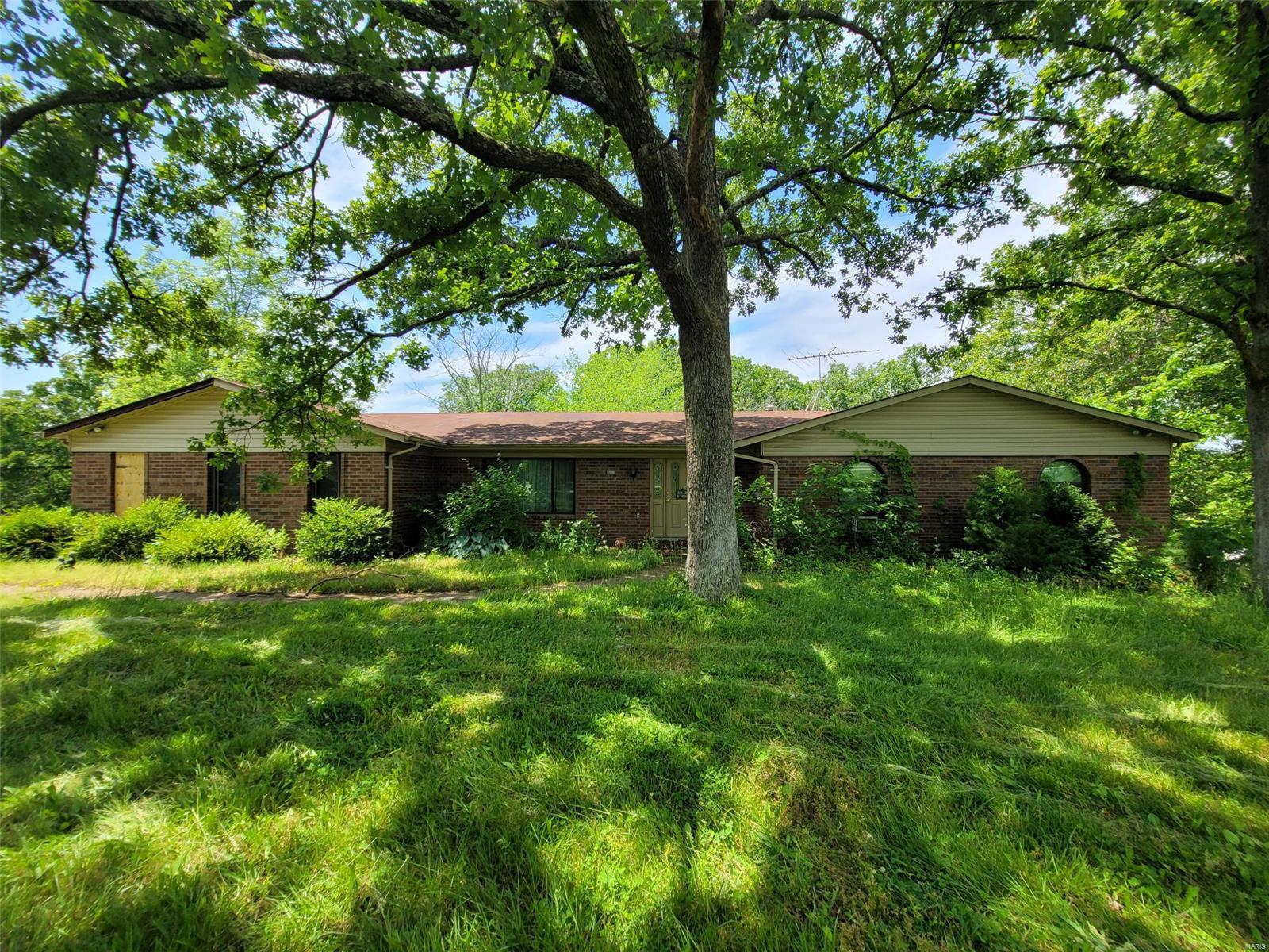 Outstanding opportunity! Sprawling ranch home situated on over 7 acres! Home boasts spacious rooms, outbuilding, and much more! Home sold as-is. Seller to do no repairs or provide any inspections.