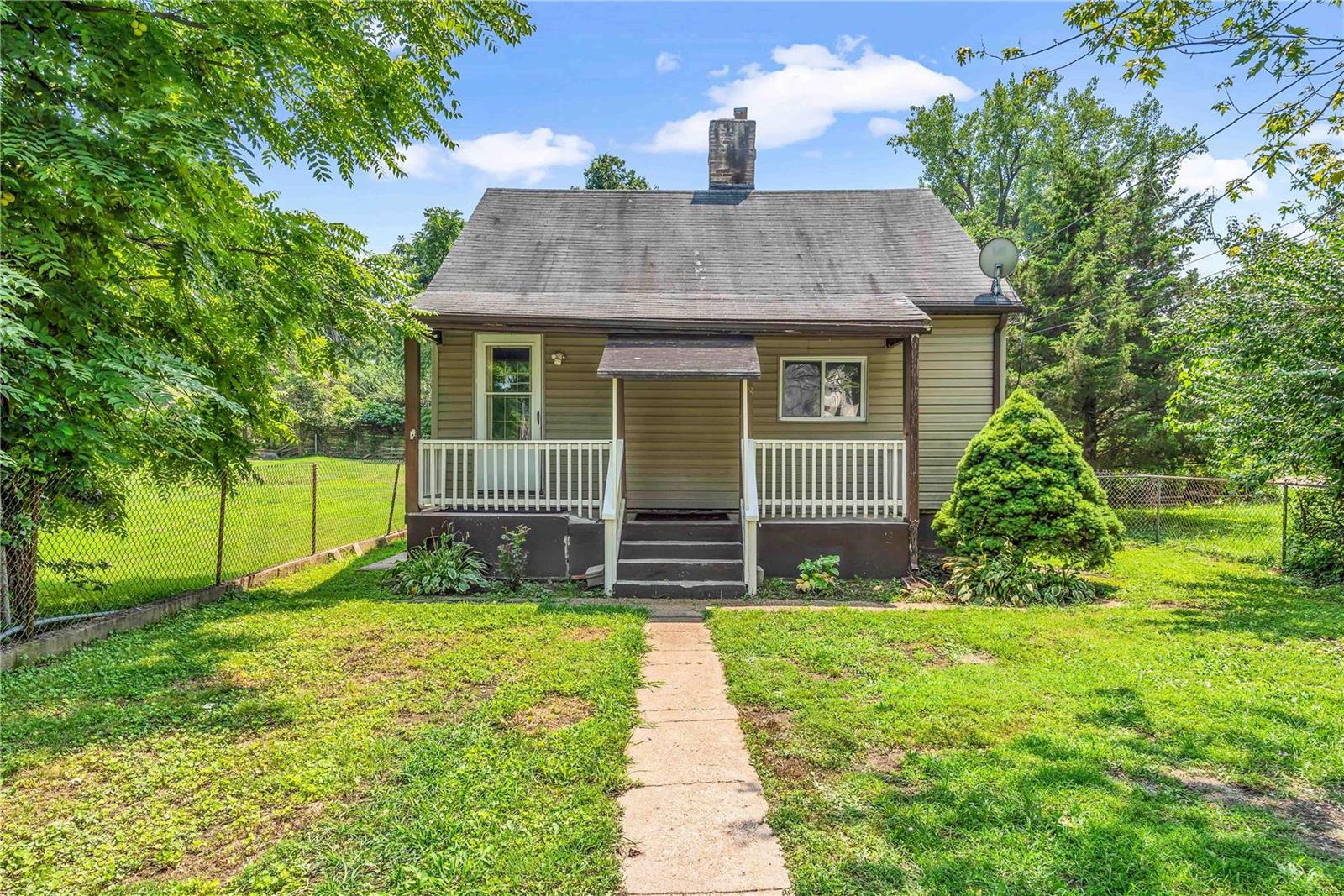 Charming home located on a quiet dead end street backing to Jefferson Barracks.  Built in 1929, this cozy home features wood board ceiling and accents, offering vaulted living rm, dining rm, kitchen, 1 bdrm, 1 full bath, and a bonus Room that can be used as a 2nd bdrm/office/sunroom, whatever you like. Enjoy the outdoors on your covered front porch, and fenced back yard, w full poured concrete basement.