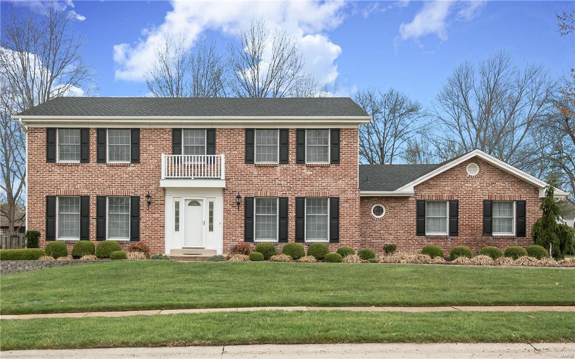 Clarkson Woods 2 story in convenient Chesterfield location (Marquette HS) has a lovely flat backyard!  Almost 1/2 acre is professionally landscaped, with an in-ground sprinkler system & partial fencing.  Kitchen is wonderfully up to date with custom 42" cabinetry, ceramic tile floor, & GE appliances including a double oven and built in microwave.  Granite counter tops include a large island for serving or just having coffee.  Front door w/etched glass side lights leads into entry with hardwood floor.  Separate dining room and living room/study w/french doors opening to great room.  Great room features brick wood burning fireplace and 2 newer sliding doors stepping out to patio.  Upstairs find the owners suite with bath (updated vanity, ceramic tile floor, shower only) & large walk in closet.  Three additional large bedrooms and a secondary bath complete the second level.  This Miceli built home boasts brick front, 6 panel doors, 2012 HVAC, rear entry garage, main fl laundry, LOCATION!