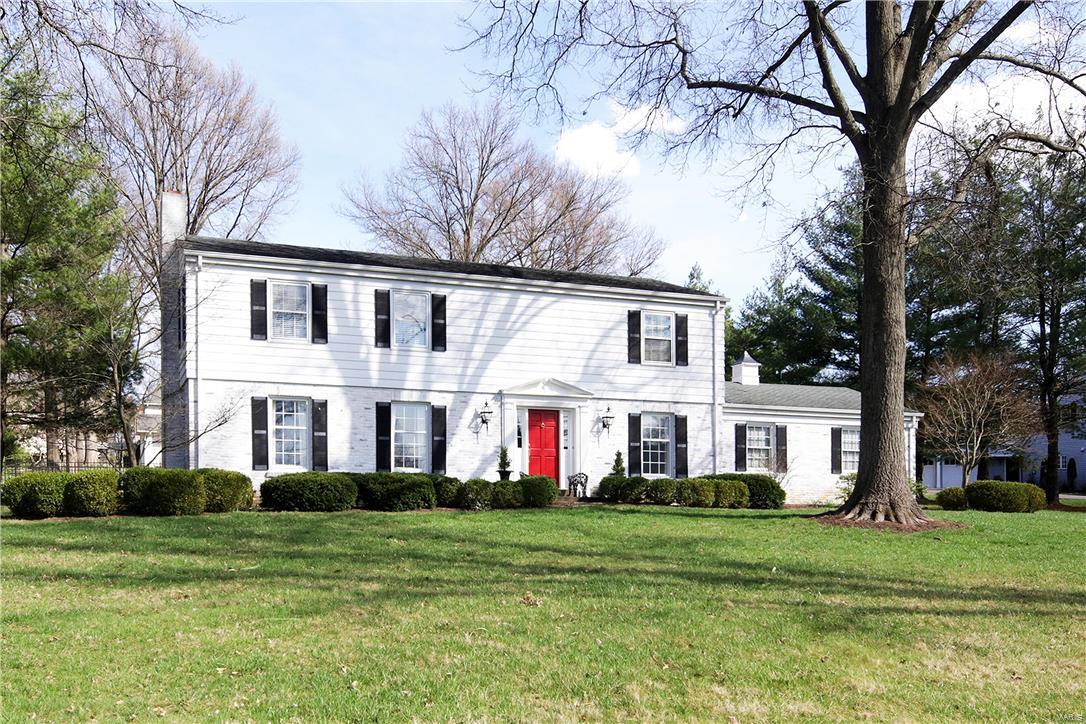 Perfect opportunity to own Higginbotham built New England charmer with kitchen and bath updates on approximately one acre of gorgeous property with a saltwater pool.  The light-filled kitchen features gas cooktop, granite countertops, hardwood floor and breakfast area.   A warm and inviting family room is enhanced by a wood-burning fireplace with brick hearth, wet bar and built-in bookcases.  The gracious living room is accented with wainscoting and a gas fireplace with marble surround.  The elegant dining room features panel molding and hardwood floor.  Upstairs, the master suite boasts a private bath with double vanities plus a sitting room/office.  Three additional bedrooms and a full bath complete the second floor.  Hardwood floors throughout.  Lower level recreation room with new carpeting.  Oversize two-car attached garage.  Security system. Newer A/C. Ladue Schools.  Experience living on a tree-lined street amongst architecturally diverse homes with gracious setbacks!