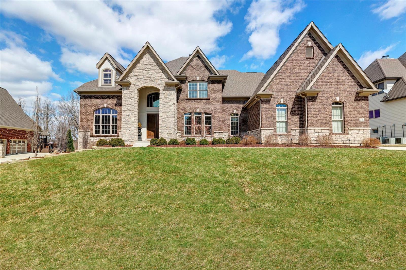 Absolutely stunning Fox Hill Farms home just hit the market in Chesterfield! Exquisite 1.5-story home boasts 4 beds, 4.5 baths & nearly 5,000 sqft. Upon entry, you'll be delighted by the grand 2-story foyer & wonderfully open layout. The kitchen is truly a dream! Entertain in style w/ the over-sized center island & breakfast bar, custom cabinetry & back splash, granite counter tops, prep station w/ wine cooler, fridge, sink & more! WOW! Enjoy the screened deck year round - complete w/ gorgeous brick-surround gas fireplace & ceiling fan. Hardwood floors span all main living areas! Main-floor Master Suite feat. his & hers walk-in closets, magnificent private bath w/ vaulted ceiling, separate sinks, custom spa-like shower & upgraded tub! Main-floor laundry, too. 2nd floor offers 3 add'l beds, ea. w/ walk-in closet, private bath! Unfinished LL walkout thoughtfully planned w/ 10' pour & rough-ins for wet bar, dishwasher, sink, full bath, laundry & full kitchen! LL & pool plans avail. Additional Rooms: Mud Room