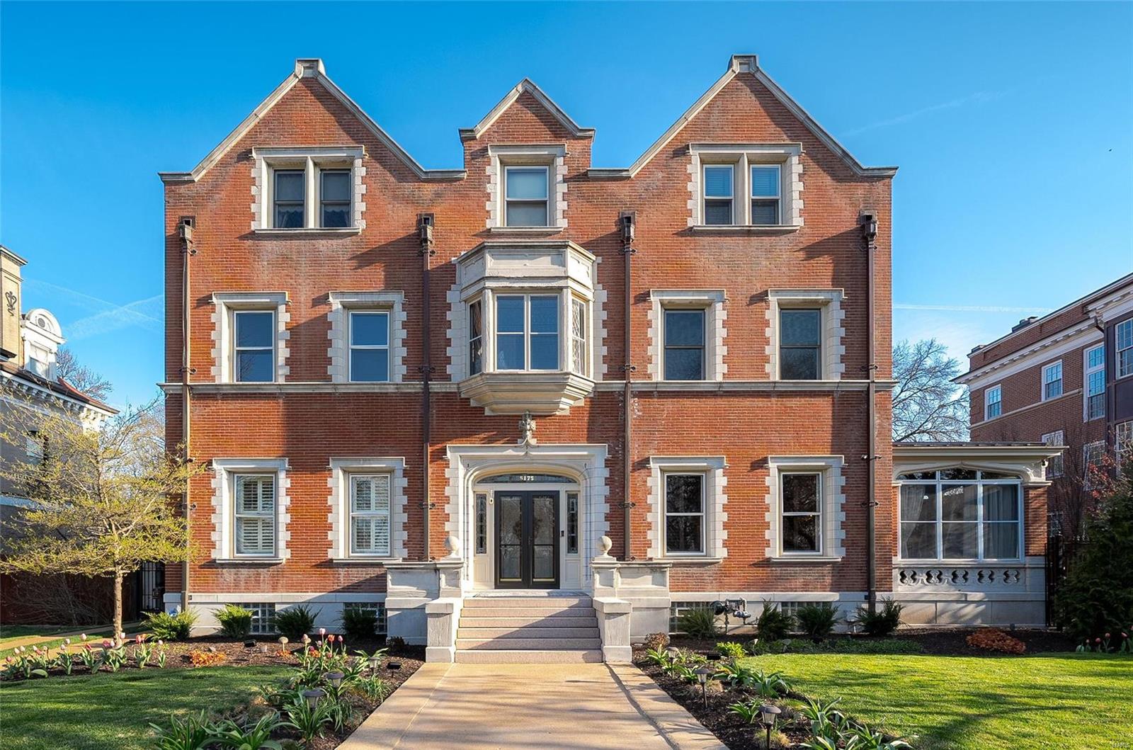 Designed by Mauran, Russell & Garden in 1899 in an Elizabethan style, this stately manse has been completely restored/renovated w/ the highest standards, craftmanship & artistry; yet offers all the civilized amenities required for today’s lifestyle. This 8,800+ sq. ft. estate features 6+ bdrms, 4.5 baths, new pool & a 2+ car carriage house w/ living quarters. Thoughtfully renovated over the last few years the home’s workmanship is unparalleled. The front door is flanked by leaded glass, which is among 52 other panels in the home.  The library features rare quarter sawn & rifted mahogany & the marble surrounding the fireplace is Argentine. The wood in the dining room is also mahogany and the wall decorations are hand applied plaster over linen. Plus, there is a beamed ceiling & a large window overlooking the patio & gardens.  NEW, spa-like primary bath w/ large, walk-in wet room w/ custom fittings. Updated, epicurean kitchen w/ high-end appliances, quartz counter tops & custom cabinetry