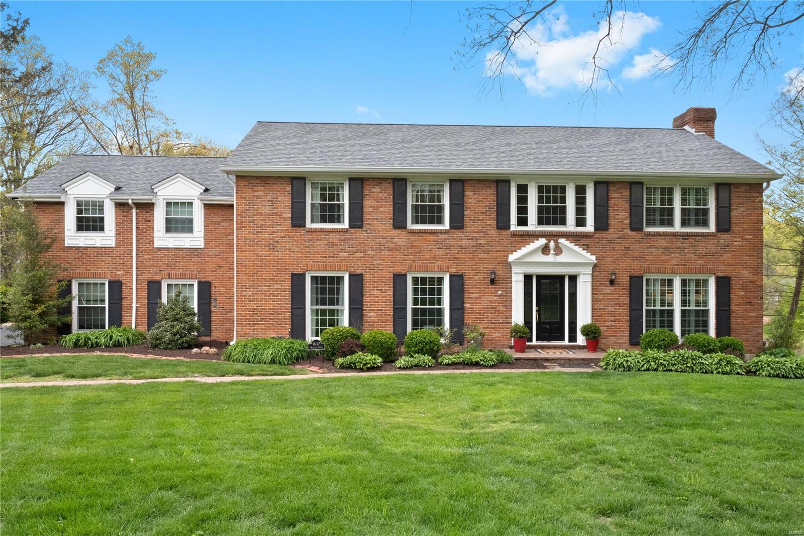 1637 Woodgate is a true classic in every sense of the word. With 6 bedrooms & 4.5 baths, this all-brick 2-story sits on a gorgeous one-acre lot and includes the most amazing pool and pool house you could ever ask for! And inside, the updated kitchen showcases custom cabinetry, a large center island, high-end appliances & granite countertops. The master suite has been renovated and includes a luxurious bath with adult height vanity, double sinks, huge walk-in shower & cast iron tub. Hardwood flooring, recessed lighting & a large walk-in closet complete the master suite. The adjoining room is perfect for an office, den or nursery. There are 4 additional spacious bedrooms on the 2nd floor and 2 additional baths. The walk-out lower level features a family room, fireplace & full bath. Additional Rooms: Mud Room