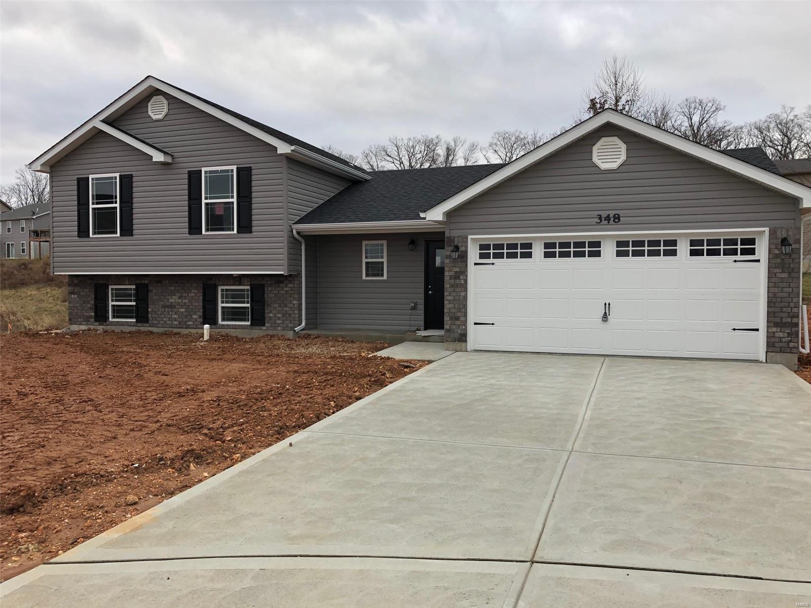 This BRAND NEW 4Bed/3Bath home has every upgrade you could imagine! They include vaulted ceilings, rounded corners, granite countertops, stainless steel appliances (including fridge), maple cabinets with "soft close", ceramic tile (in kitchen, baths), custom neutral colored paint job throughout, framed windows, taller baseboards, adult sized cabinets in bathrooms with marble countertops, walk-in closet, upgraded carriage doors on an oversized 2-car garage with openers, 6 panel doors, and upgraded water/light fixtures throughout the house! (Fully sodded yard coming soon!)