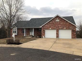 *PRICE REDUCED $10,000* YOU FOUND IT! SO PRIVATE! GREAT LOCATION! End of cul de sac! Backs to woods! Xtra Wide Level Driveway! Ovrszd 2 car Garage w/2 Doors! Freshly painted! New carpet! Roof & gutters 1 yr old! Main floor & basement LAUNDRY. Divided bedroom floor plan. MASTER has spacious w/i closet & ensuite w jetted tub, separate shower, dbl vanity & closet. GREATROOM has vaulted ceiling, gas fireplace, hardwood floors & built-in surround sound. Open KITCHEN has lots of cabinets, Appliances & Breakfast bar. Lg DINING space w sliding doors overlooking wooded backyard. Updated DECK has new composite decking. AND WOW THE FINISHED W/O BASEMENT could be another Living Space or even an Airb&b. Stained concrete floors. Spacious Entertainment/Living area, Lg Bar, Granite Countertops, Fridge, Microwave, Dishwasher, lots of Cabinets & TV. Spacious 4TH BEDROOM w w/i closet. 3RD BATHROOM has Lg w/i (Travertine tile) shower w 2 shower heads. Huge workshop/storage space w dbl doors to back patio.