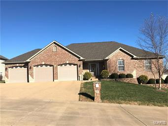 As soon as you see this house you will think "Chip & Joanna were here". This house screams MOVE-IN ready! As you walk in, you'll fall in love with the airy entrance, openness & beautiful Brazilian hardwood floors & so much natural light! The kitchen features custom cabinetry, breakfast bar & pantry. To highlight the breakfast room there is a custom built-in wall - gorgeous! Master suite offers a very spacious walk-in closet & the master bath features his/hers vanity, custom cabinetry & separate shower/tub. Large main floor laundry just off the kitchen that features a tucked away 1/2 bath. The walkout lower level has 9 ft ceilings, is roughed in for a bath & just waiting for your finishing touches! There is also a giant storage space with shelving. 3 car over-sized insulated garage too! Don't forget the outdoor space - a 16 x 14 covered & maintenance free deck - perfect space for relaxing after a long day. Professionally landscaped, freshly painted & new roof too! Don't walk - RUN!