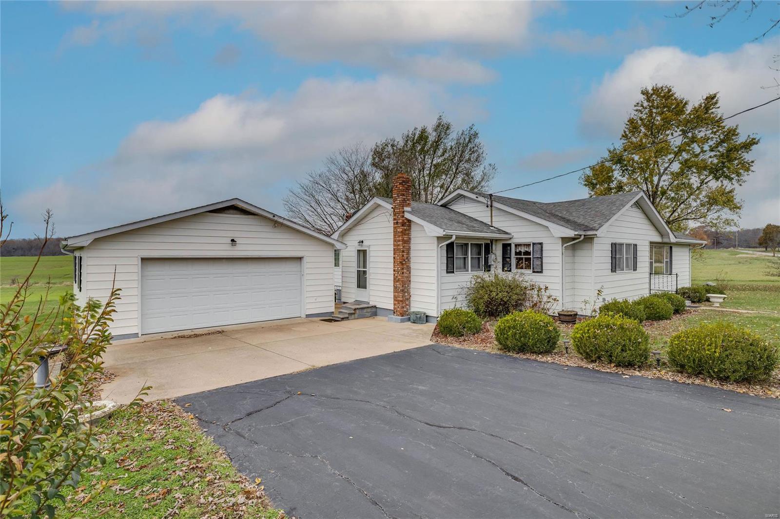Say hello to this super clean, well-maintained, 3-bed, 2-bath gem just minutes from town—perfect for when you need to hit civilization but still want to pretend you’re off grid. With 1800 sq.ft. of living space on 3 glorious acres (yes, three!), complete w/a wet-weather creek that occasionally feels fancy, you’ll be living your best nature-meets-modern-life dream. Inside, you'll find a large kitchen with ample counter space perfect for whipping up feasts or stacking takeout containers, and a woodstove so powerful it could probably roast marshmallows from across the room—no shivering allowed here. Choose wood with forced air, or baseboards! The walk-up basement offers even more space for all your  “I’ll-finish-it-one-day” projects. Outside, the detached two-car garage comes with an attached workshop, perfect for storing tools, building things, or hiding from chores. Oh, and there’s a shed too, because who doesn’t love bonus sheds? Schedule your tour today and let the good times roll!