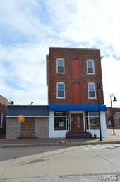 Historic 3 story brick building on Main Street Wentzville. Be a part of the renovation of the DOWNTOWN WENTZVILLE DISTRICT. New business and new roadways coming soon. Great spot for Corner Bar, Liquor Store, Pawn Shop, Beauty Salon, Wine Store and More - Upper levels would be great LOFT APARTMENTS.
Main level has 1850 SF. Security cameras and locks.
2nd and 3rd levels are accessed through stairwell on side of building. 2nd & 3rd levels have 1100SF each.
3rd floor current use is apartment.
All levels electric and metered separately - water & emergency lighting is common expense.
Large parking lot in back.
Sale sign on side of building. Schedule appointment through listing agent. Location: Corner Location, Downtown, High Traffic, Retail Center