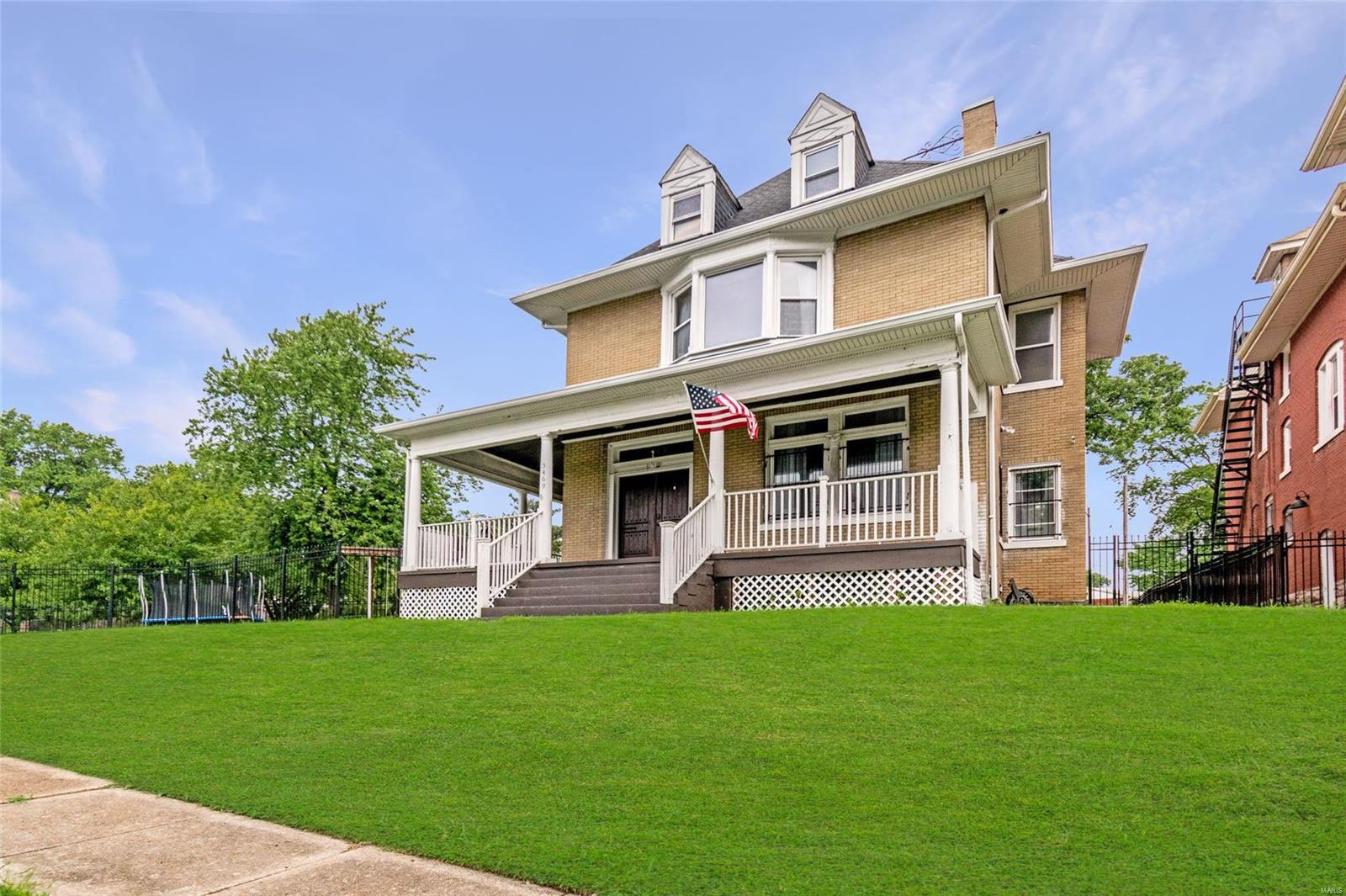 Gorgeous Full Brick/stone 2.5 story home with wrap around porch, gated, off street parking, located minutes from Forest park, Washington University, Delmar Loop, Museums and restaurants. This is a must see home! Double front door entry, wood and ceramic floors, some original mill work, pocket doors, ss appliances, Granite counter tops, glass tile back splash, large windows, tall ceilings, exposed interior brick walls. Front and back staircases. Master suite, includes, fireplace in separate sitting area, Bay window with window seat, massive closet and private bath. You will love the convenience of the 2nd floor laundry along with a laundry in the basement as well walk out out access. Beautiful space lots of new fixtures, and sooooo many possibilities for this Gem of a home.