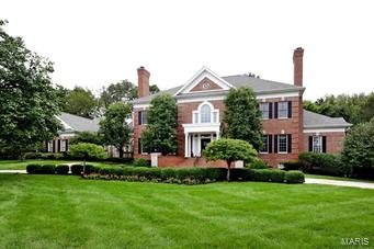 An amazing Johnson built home for the very discriminating buyer. It features every possible amenity including 3 family rooms, an enormous, remodeled first floor master suite on the first floor. The kitchen is a cook's dream and opening to 3 rooms with built-in catering facilities. The millwork is outstanding. The ceilings soar, there are 3 built-in bars and a beautiful paneled library in addition to all of the other entertaining rooms. The dining room is elegant and will accommodate at least 12 guests. The second floor has 4 additional bedrooms with baths, one of which overlooks the 2-story living room. The completed lower level is ideal for grand entertaining with a 3-sided professional bar.  There are multiple game rooms, exercise rooms, full bath, see through fireplace, and a thousand bottle wine cellar. Very attractively priced by comparison to other homes of this size. Over 7,800 square feet on a private acre in this exclusive subdivision of comparable finer homes.