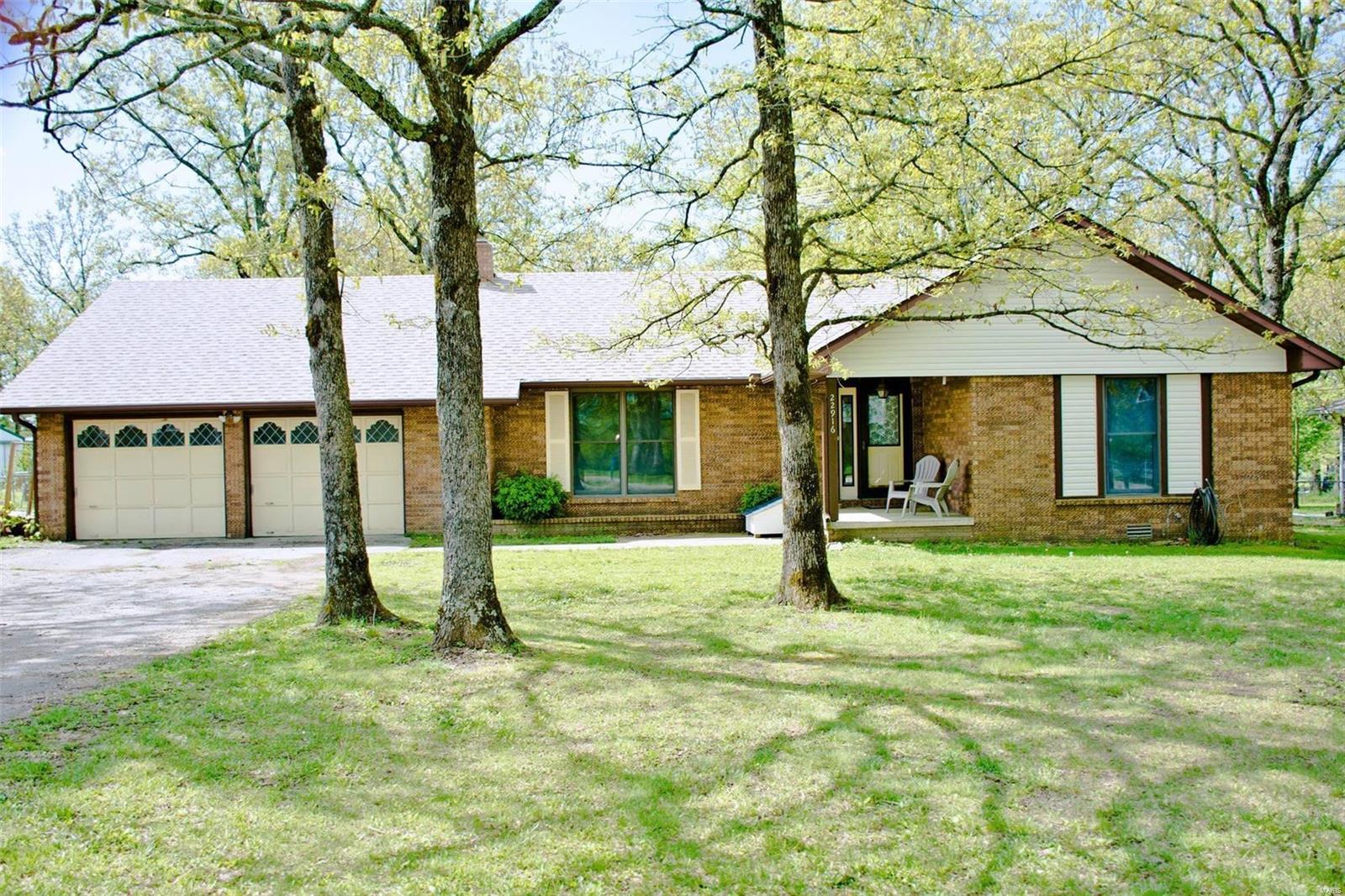 Home sweet home! If you're looking for a place just outside of city limits, this is it! This charming 3 bed 2 bath brick home sits on a half acre with lots of mature trees. The living room boasts a brick wood burning fireplace, perfect for keeping the electric bill down in the winter. The kitchen is equipped with stainless steel appliances and a breakfast bar. Outside you'll find a fenced in back yard with a patio area for entertaining, or just reading a book with a cup of coffee! In need of a man cave? There is an additional shop building that has cement floors and electric! This home won't last long, schedule your showing today!