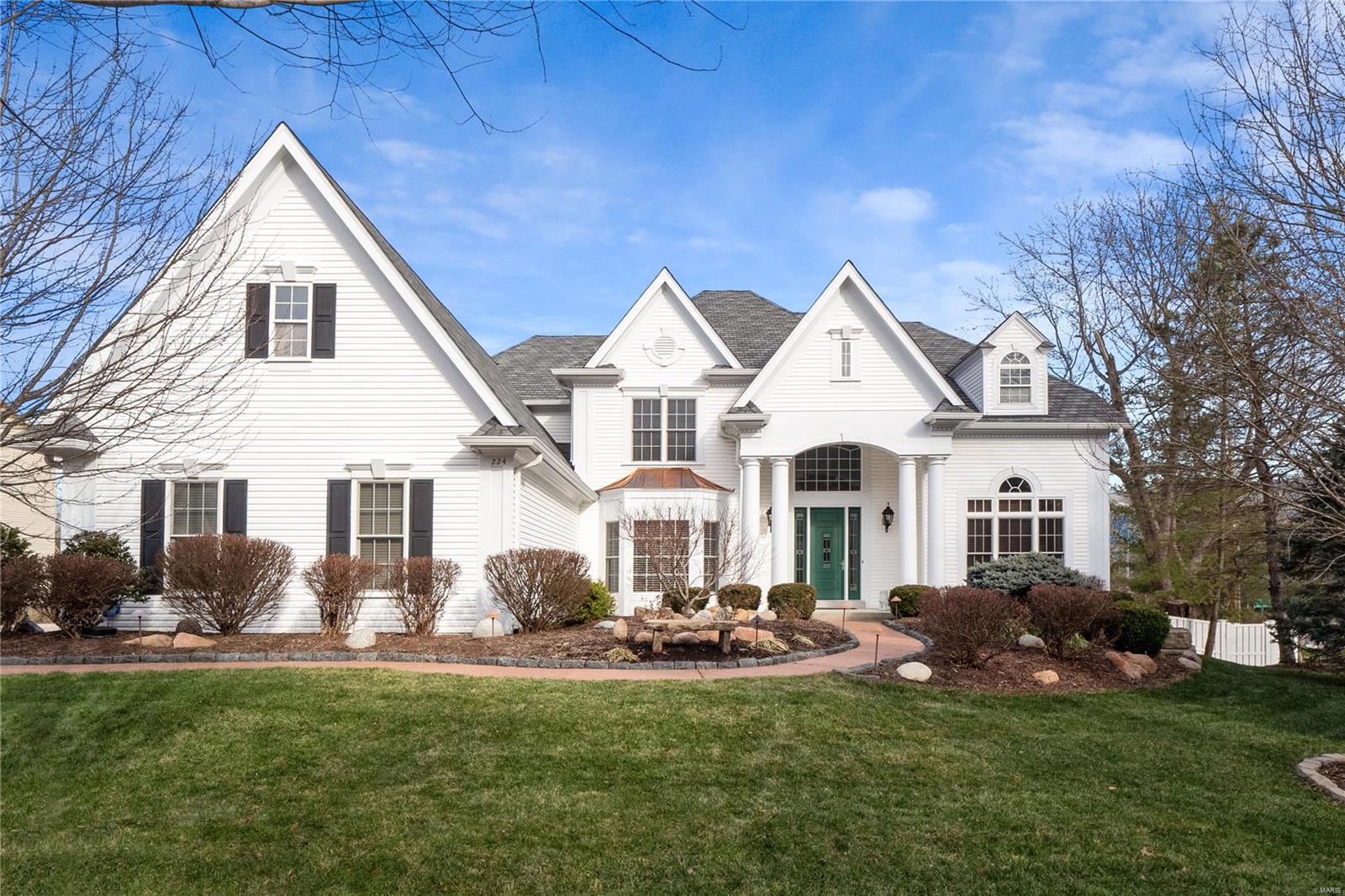 Elegant Simon Homes former display. This pristine 5 bed, 4.5 bath, 1.5 story welcomes with a stately two story entry, flanked by the formal study and dining room. Spacious great room with window wall, gas fireplace, built ins and wet bar. Renovated kitchen has center island, custom cabinets, granite counters and SS appliances and opens to the breakfast room and hearth room with a brick and stone fireplace. Main floor master suite has a luxury ensuite bath with dual sinks, tub and oversized, tiled shower. Upstairs find three bedrooms with walk in closets and two full baths. Walk out lower level is perfect for entertaining – family room, wet bar, game room, sound room, bedroom, bath and ample storage. Level, fenced yard backing to common ground. Dual staircase, MF laundry, 3 car garage, custom mouldings, inlaid hardwood floors, plantation shutters…approximately 6,300 square feet of living! Award Winning Rockwood School District. Excellent location close to amenities and highway access.