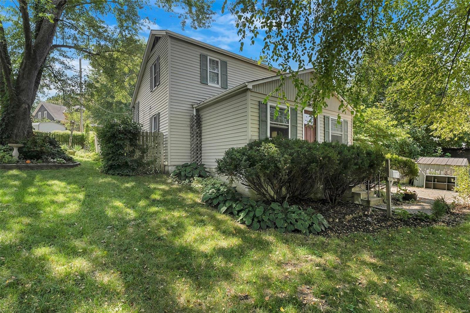This beautiful Washington home is ready for new owners! Close to the Washington River front,  the convenience and walking distance to parks, schools, shopping and restaurants can't be beat! Tax records state this is a 2 bedroom home, but there is a large room on the main level that can be used as a 3rd bedroom. Walking through the front door, you are surrounded by the charm and the warm welcoming feeling of home. Gatherings with family or friends would be perfect in the fenced backyard. The extensive garden is unmatched, featuring strawberries, thornless black berries, black raspberries, 2 fig trees, an apple tree, patio peach tree, asparagus plants, etc. , as well as a wild flower garden, and a massive pollinator garden that attracts multiple species of butterflies each year. Choose from electric or wood burning furnace heating in the winter. The hot water heater was replaced in 2022, and a new clean out was newly added. This home has so much to offer, schedule your showing today!