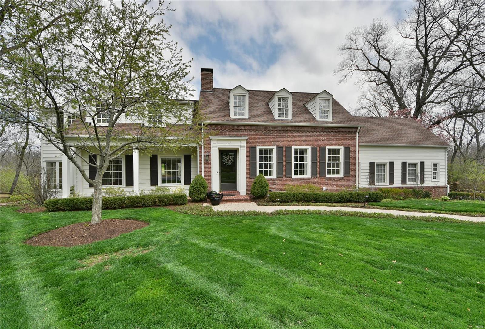 This captivating Cape Cod home in popular Briarcliff offers beautiful views with privacy and an open floor plan everyone will enjoy! The center hall entry foyer welcomes you home opening to the large formal Dining room & living room with built-in bookshelves & French double doors to the terrific sun room which walks-out to a huge brick patio & large yard backing to the woods. The great room features a soaring cathedral ceiling, real wood paneling and exposed ceiling beams, with a gas fireplace & a walkout. The chef in you will be amazed with the spacious custom kitchen! This gourmet kitchen boasts a large center island, gleaming granite counters, Dacor ovens, cook-top, & 42 inch custom cabinetry with large breakfast room and custom coffered ceiling. Main floor laundry & convenient powder room. Master suite includes his & hers closets & luxurious private bath with Jacuzzi tub. Partially finished LL. 2 car attached garage. This meticulously Maintained home is ready for you to move into! Additional Rooms: Sun Room