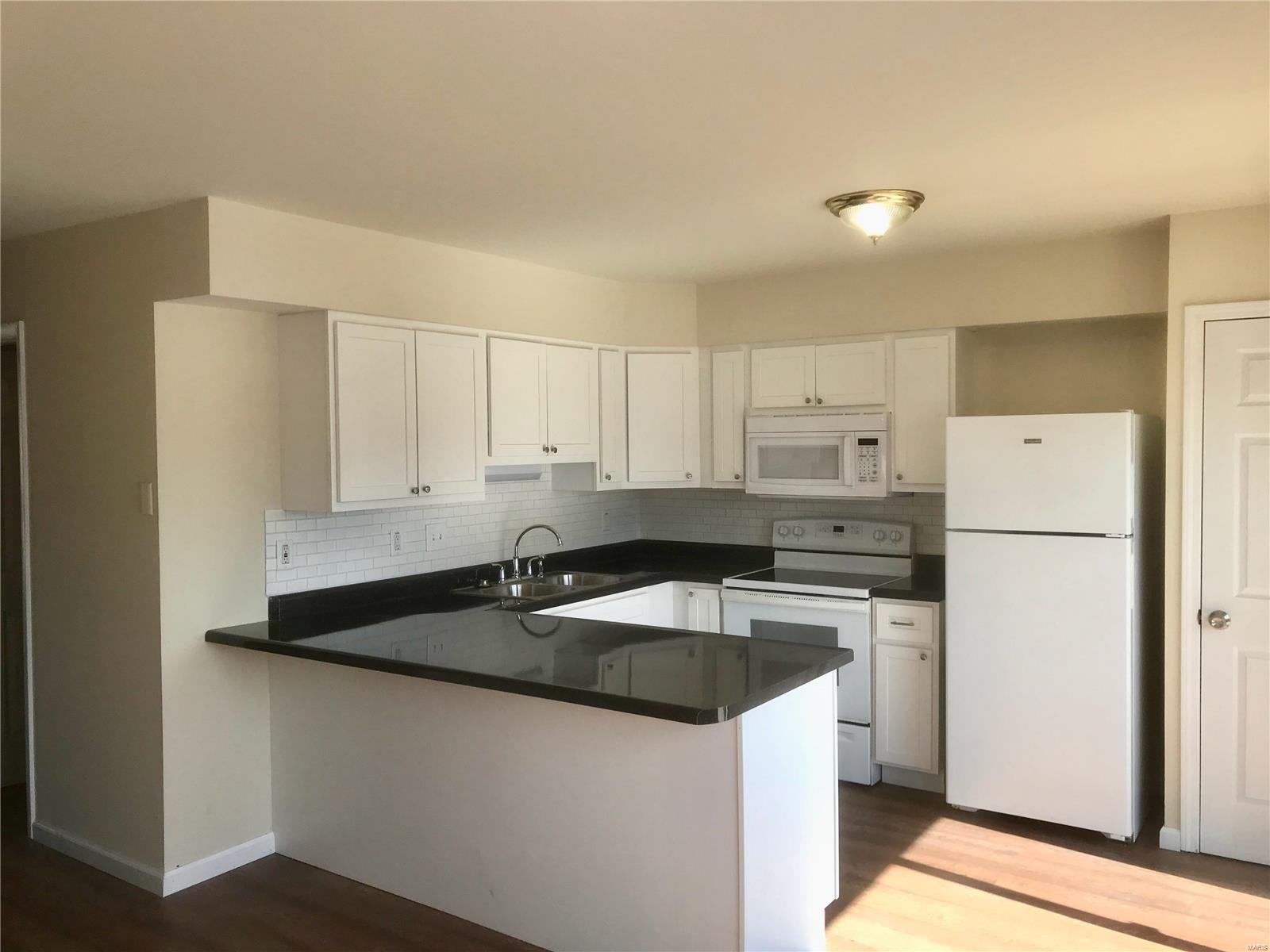 Totally renovated 3 bedroom 1.5 bath Townhouse. New wood-look plank flooring throughout, New kitchen cabinets, dishwasher, microwave, windows and countertop. Water, sewer, trash, swimming pool included in rent. Tenant just pays electric utility. Easy access to shopping, restaurants and schools. Comes with refrigerator, microwave, dishwasher and stove.outside storage shed and private patio. No basement. Washer & dryer hookups. $1050 per month rent. $1000 security deposit.   Pets ok upon approval and security deposit. No smoking allowed in home. Florissant School District. HUD Section 8 approved.