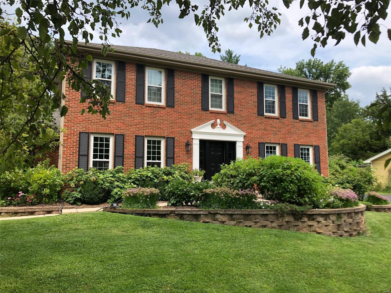 Beautifully renovated home in Spring Valley! Prime central location with easy access to 270, 40, 44, Manchester & Ballas. Elegantly updated by current owners, featuring a stunning kitchen with white cabinets, granite counters, stainless appliances, and seamless flow into a great room with built-ins, fireplace & wet bar. A sunlit dining room is perfect for gatherings, while the living room offers serene space to unwind. Spacious laundry area conveniently sits beside the oversized garage. The enchanting primary suite boasts a newly renovated luxury bath & walk-in closet. Three additional bedrooms share a stylishly updated bath. Lower level includes an office, family room & modern half bath, plus abundant storage. The backyard is a true masterpiece with an updated pool, deck, lush landscaping & top-tier water mitigation. Updates are many and include windows, exterior doors, paint throughout the  home & so much more. Must-see for buyers seeking a move-in-ready home in the central corridor!