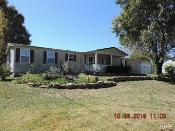 You won't find a better opportunity than this one! Please view this great 3 bedroom, 2 full bathroom manufactured home, nestled on 1.240 Acres just minutes outside of Bonne Terre in the North County School District. Home offers nice bright & open floor plan featuring a living room w/large built in cabinet/shelving with French doors that lead out to the back covered porch. Large kitchen with skylights & loads of cabinet space & adjoining dining area. Main floor laundry, storage area, nice master suite with Jacuzzi tub & separate shower. 2 more good sized bedrooms with ample closet space complete the floor plan of this home. This home also comes with a nice attached two car garage! There's a nice level back yard that perfect for playing a nice game of back yard catch, or planting that perfect garden you've always wanted! There's also a large garden/utility shed perfect for all of your lawn maintenance tools. This home has SO much potential! Call to Schedule your personal viewing TODAY! SpecialListingConditions: Foreclosure