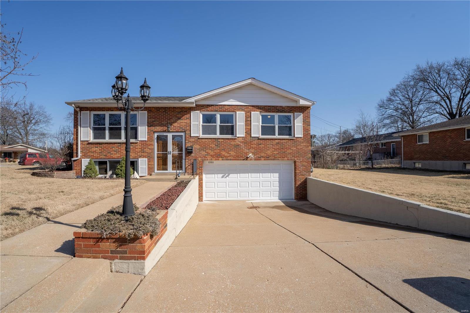Well updated 3 bedroom 1.5 bath on a large corner lot!  Tons of kitchen cabinetry, updated wood floors and woodwork, natural light throughout, a new vanity with dual sinks in the main floor bath. Thermal windows and patio doors.  New carpet in the bedrooms.  Rec room, updated 1/2 bath and laundry area in the lower level.