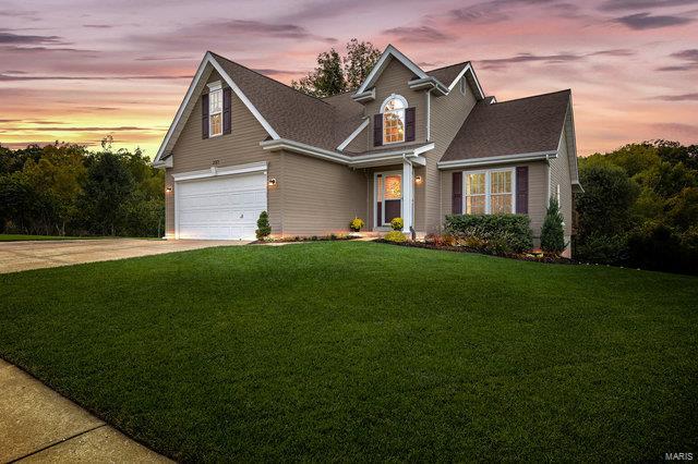 Welcome home to this meticulous 1.5 Story in desirable Harter Farms Subdivision. The community offers a clubhouse/swimming pool. CORNER LOT! The main floor includes a spacious vaulted great room and an open kitchen with 42" cabinetry looking into the cozy breakfast room. The master suite offers a nice size walk in closet, his & her's vanities and a separate tub/shower. Upstairs you will find oversized secondary bedrooms and a loft perfect for a remote office. The finished lower level boasts a walk out, rec room, office/workout space, full bathroom & plenty of room for storage. Some other, newer, interior features include a water heater (1/22), upgraded pad/carpet (2019), double hung windows on the 1st floor (2016), security system, radon mitigation system & newer lighting throughout. Some exterior features include a 3rd parking pad, architectural shingles (2019), sprinkler system, vinyl fencing, and a covered deck with custom privacy shades perfect for entertaining friends & family.