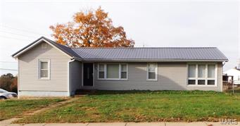 Great Location!  This 4 Bedroom, 1.5 bath Ranch home sits on a corner, double lot.  As you enter the front door, you'll be in the livingroom/breakfast room combo.  The kitchen has been updated with custom cabinets, ceramic tile flooring and a backsplash.  The appliances, and the washer/dryer will stay.  This is a split bedroom plan.  The master suite has a 1/2 bath.  On the other side, you'll find 3 more bedrooms and a full bath.  The main floor features wood floors, ceiling fans and neutral paint throughout.  The basement is unfinished with a tuck under garage.  The exterior features a covered deck in back, vinyl siding and an aluminum roof.  The back and side are fenced.  The only thing missing is YOU!