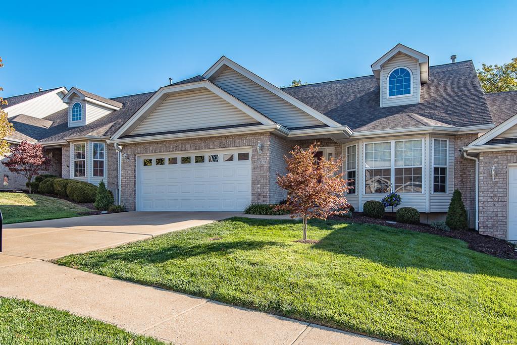 Exquisite meticulously maintained villa in the heart of Oakville! This unit has it all with over 2500 sq ft of living space. Vaulted ceilings thru-out liv, din, kit, breakfast room & master bedroom. Hardwood flooring in liv, din, breakfast rooms. Living room has gas fireplace. Kitchen boasts tons of 42" wood cabinets, solid surface Corian countertops, 18" tile flooring, pantry, stainless steel appliances and main floor laundry. Huge screened in porch/deck off breakfast room! Large main floor master w/ bay window, walk-in closet, luxury bath with double sinks and sep. jet tub and shower. 2nd bed on main level is huge w/ bay window, Jack N Jill entrance to full bath. Builder finished lower level w/ 9 ft. ceilings, gigantic family room w/ wet bar, 3rd bedroom, full bath, walk-out to patio & huge utility/storage room space. Association fee includes irrigation system and driveway replacement Location: End Unit, Ground Level