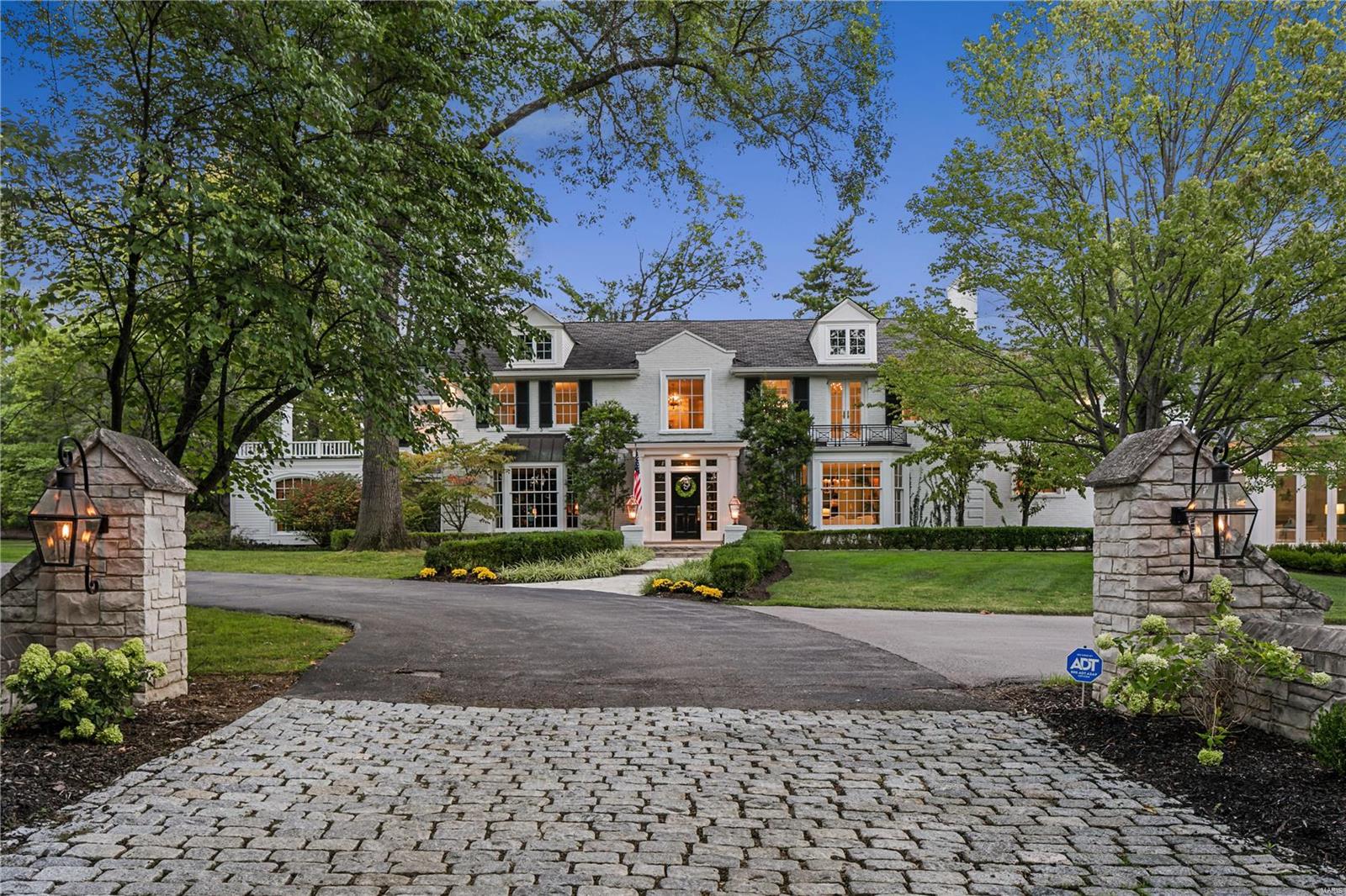 Stunning two-story Colonial house with “Art Deco” interior spaces influenced by renowned architect Frederick Dunn. 
Main floor has a smashing octagonal shaped room with vaulted ceiling & crowned with a glass dome that opens to 3 private acres  and a new pool with an outdoor shower. A brand new jaw dropping kitchen with loft above, new office space, mud room, and a 5 car garage. Plus a cozy den/music room with a fireplace, an attractive large office to easily work from home in the quiet end of the house, art gallery, entertaining hall with wet bar, and family friendly room near the pool
The spacious upstairs does not disappoint; a private Primary Bedroom Suite with a large and gracious bedroom with a vaulted ceiling and private balcony, plus two dressing rooms, each with custom built-ins and sitting areas, two separate private updated and new bathrooms with heated floors, and a coffee bar
Plus, 4 more large bedrooms and 3 full baths, and roomy laundry area. Additional Rooms: Mud Room