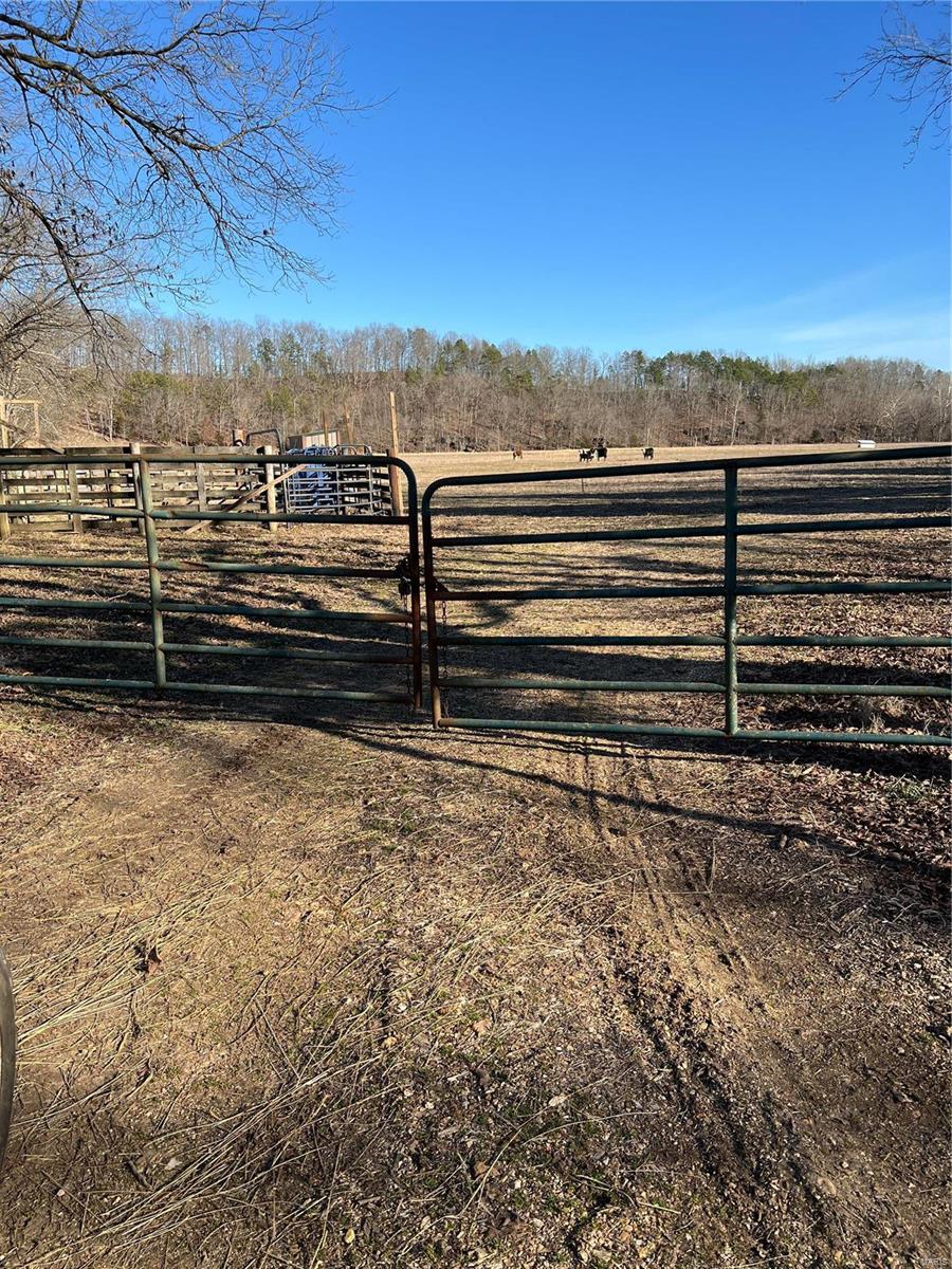 43+/- acres situated off of V highway just outside of Piedmont . 32 acres of the property is good pasture land ,and 11 acres are timber . The property has some beautiful building sites. Fenced and cross fenced , small round pen ,cattle on the property . Electric is already on the property as well as a artesian well , put in by the USDA, is part of the Conservation Reserve Program Contract , the USDA pays owner $90 a year as part of this program . There are two small ponds on the property and also a year around creek, which runs along the outer part of the property. Must see . This is the place you need to build your dream home . Call Listing office today .