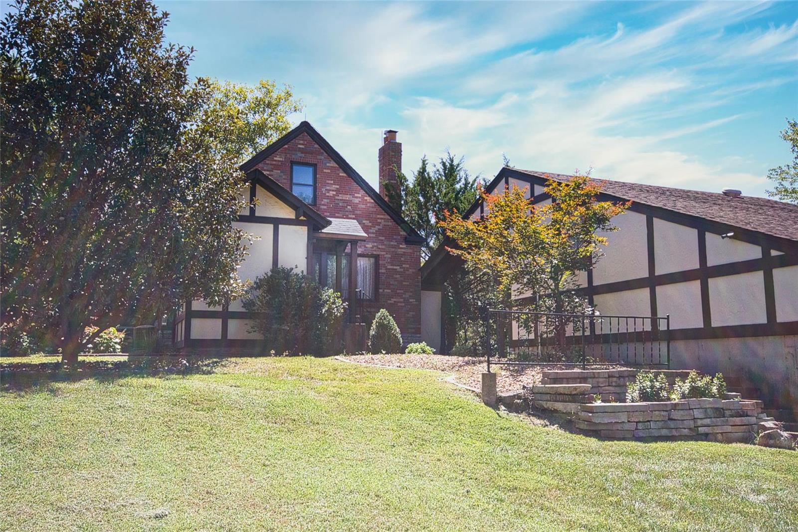 Discover elegance in this stunning home nestled within the prestigious Lindbergh School District, offering unparalleled comfort and convenience. Moments from Sunset Hills Country Club and with easy access to Interstate 270, this property seamlessly blends luxury with accessibility. Upon entering, you'll be greeted by hardwood floors that extend throughout the main living areas, creating an opulent and warm atmosphere. Two fireplaces, one in the spacious living area and another in the inviting family room, provide the perfect setting for cozy evenings. Entertain with ease in the kitchen featuring stainless-steel appliances. The 9-foot ceilings throughout the home add grandeur to the living spaces. Step into your outdoor sanctuary, a serene space featuring a rambling brook ideal for relaxation. The fully finished basement is versatile with a full bathroom and workshop . Restaurants and shopping options are conveniently nearby, enhancing your modern lifestyle amidst serene surroundings. Additional Rooms: Sun Room