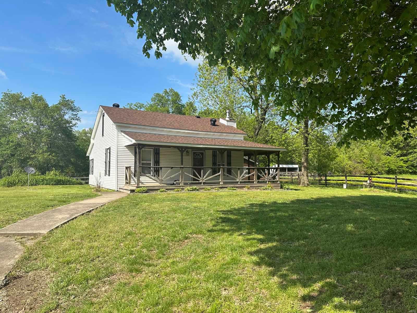 This property has 4.130 acres & is an outdoors & animal lovers delight. There a 1 1/2 story home w/ central heat/air electric & an extra window air unit upstairs. Living room has electric fireplace &the kitchen has electric smooth top range, microwave hood/fan & a side by side refrigerator. Washer/dryer stays &  laundry tub. One bedroom on the main floor & stairs lead up to two more upstairs rooms...two bedrooms or an office & bedroom. Enjoy the covered & open deck areas built at the front & east side of the vinyl sided home. On the east side of the home, you will love the 14 X 20 bunk house w/bedroom, 1/2 bath & large closet. It has a window air unit & the pump for the water source is located in the bathroom cabinet. Other buildings include a 20 x 24 garage/workshop w/ concrete floor, a 30 x 30 barn for horses with two stalls & spaces for equipment. A 14 X 12 loafing shed & lots of fenced areas for cattle and/or horses. Beautiful views & nature surround you. Bell City School District. Additional Rooms: Mud Room
