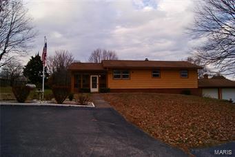 COME CHECK OUT THIS AMAZING HOME! This 3bd 2 bath house sits on 3.2 Acres, has beautiful original hard wood floors, rock fire place, custom cabinets and so much more.  Enjoy entertaining in your partially finished basement and serve your friends from your custom built wet bar.  Sellers are offering a home warranty with this purchase. THIS HOME WILL NOT LAST LONG