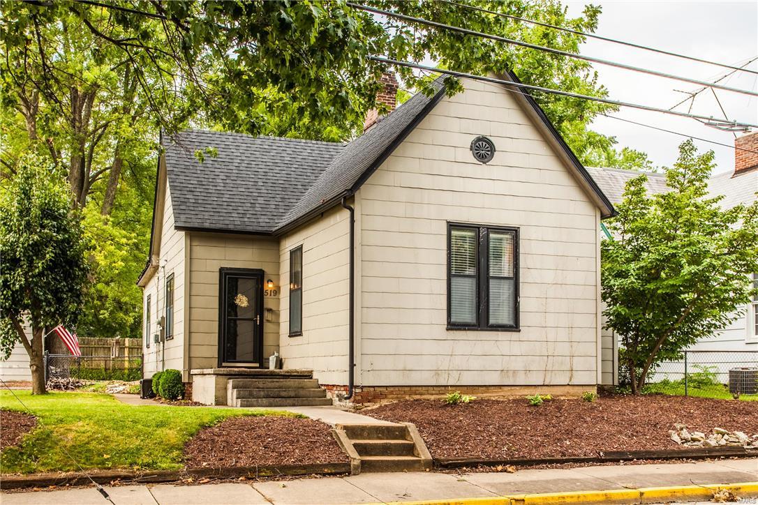 This beautiful light-filled home blends historic character with plenty of updates.  The historic details are evident in the gorgeous, original wood floors, 10’ ceilings, millwork, pocket door, and oversized windows. The updated kitchen includes a newer dishwasher and oven/range, custom cabinetry, and ceramic tile flooring, complete with a side breakfast room! The master bedroom has a new custom walk-in closet while still allowing plenty of space for all of your furniture. The 2nd bedroom has 2 large custom closets with built-ins, giving you additional storage! The updated bathroom has ceramic flooring and a linen closet. Entertaining is easy with the spacious living and dining rooms and beautiful back yard with its stamped concrete patio and lush, level lot. The main floor laundry, oversized 2 car garage, 3 car parking pad, newer HVAC (‘13) and roof (‘15) are just a few more of this charming home’s assets. Seller to do no garage repairs.