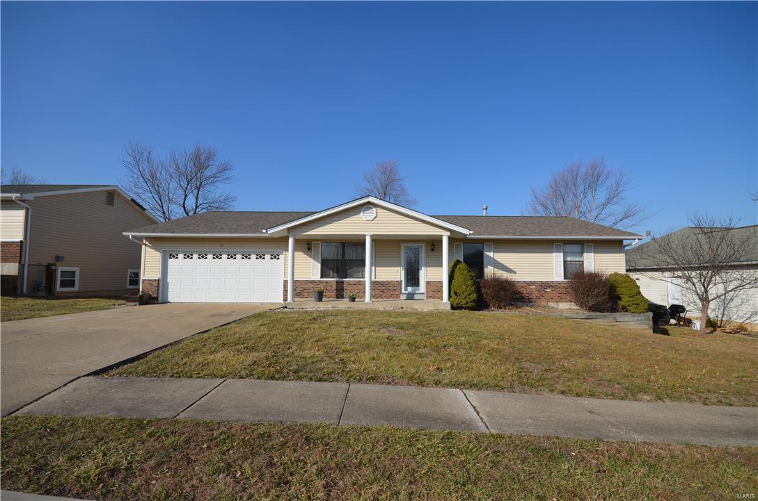 Great location move into this immaculate 3 bedroom 2 bath ranch home. Nice entry foyer with all updated wood flooring. Fresh paint, white 6 panel doors. Super bright and cheery big kitchen with stainless steel appliances and black double oven gas range. Beautiful back splash with lots of counter space and custom cabinets. Large Great room boast cozy brick fireplace along with lots of family space.  Nice size Master bedroom with all new updated bathroom.  Bedroom 1&2 also spacious bedrooms with newer closet doors and fresh paint. Super backyard has nice big patio along with extra garage for storage. This is great home and right in wonderful Wentzville. Come see how wonderful this home could be for you.