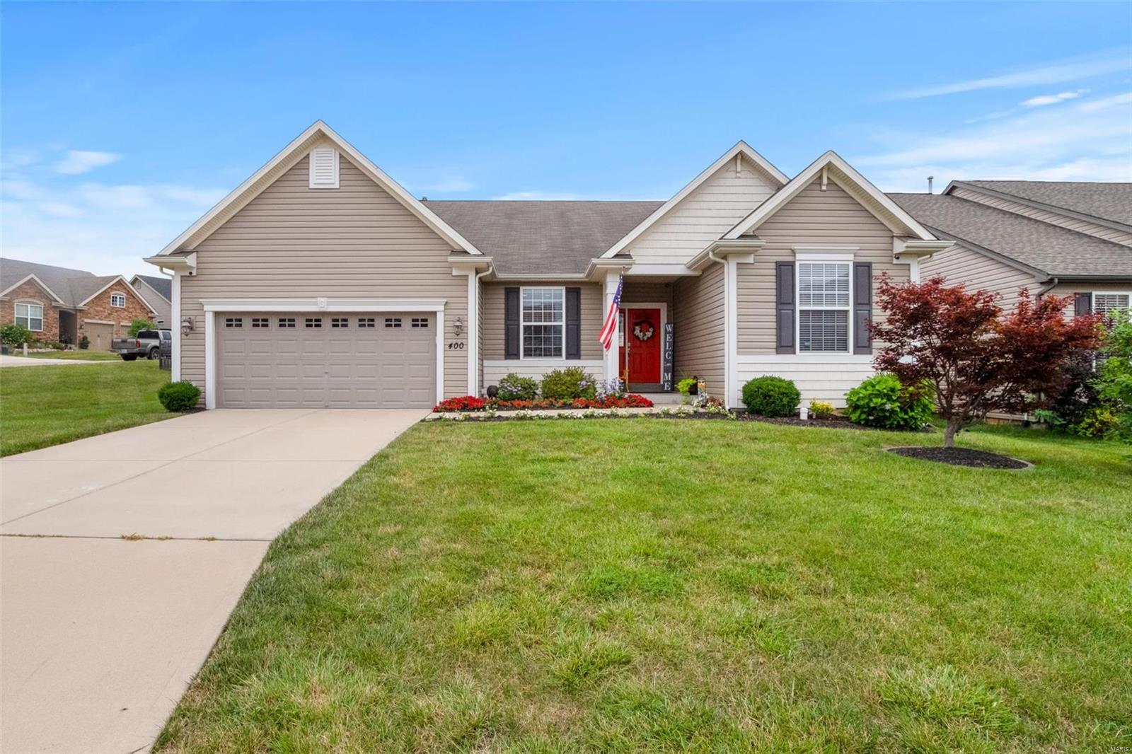 Stunning, pristine ranch! Many upgrades and extras in this light, bright, open home! Plank hardwood flooring in living areas & Master Bedroom. Kitchen has 42" cabinets, newer granite appliances, & breakfast bar that overlooks the Great Room. Nine foot ceilings; separate Dining. Step from Breakfast Room to patio where you'll enjoy the spectacular sights & sounds of a gorgeous custom waterfall/pond. Split bedroom floor plan means the Luxury Master Suite is privately tucked away from other bedrooms. French doors in foyer open to office. Newly carpeted 9ft pour LL offers Family/Media room, 4th bedroom, 3rd full bath & storage. 3 car tandem garage: one bay is 39 feet deep! Nicely landscaped yard is surrounded by premium aluminum fencing. Superb location with convenient access to Highway 94 (Page Extension), minutes from St. Louis County. Desirable Bella Vista Subdivision and St. Peters lifestyle- named by Money Magazine as a top best place to live! Put this on your MUST SEE list!