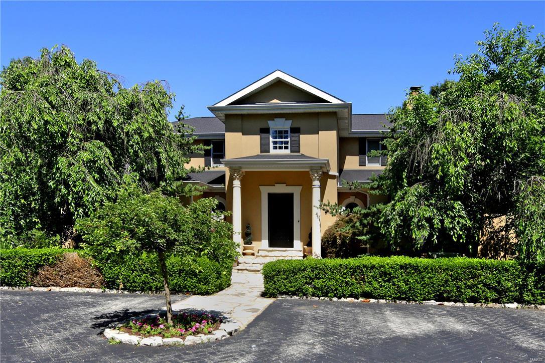When you step into the entry you will feel like you have discovered your own private resort. Tucked away on an acre plus lot, this four bedroom home has it all. The great room features a painted domed ceiling, raised hearth fireplace and large picture windows that over look the Pebbletec pool with a waterfall feature, patio with an arbored pergola, and newer outdoor kitchen with fireplace and smoker. The first floor also boasts a formal living room, family room with built in cabinets and bookshelves, an eat in kitchen with center island and planning desk and first floor laundry room. The spacious main floor master has a huge walk in closet with built in dressers and a bath with walk in shower and double sinks. Upstairs you'll find three more bedrooms and two full baths. The expansive lower level has a family room with a slate floor, stone fireplace, wet bar and 1000+ bottle wine cellar. There is also a play room with built ins, an exercise room and fabulous full bath with steam shower.