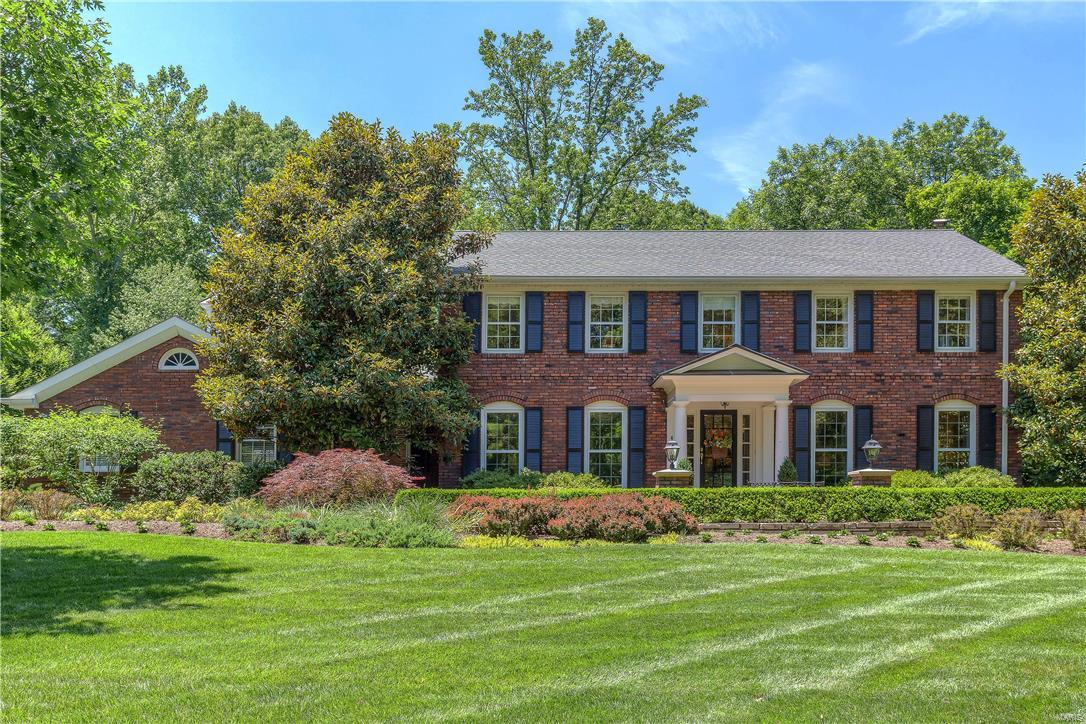 Classic-styled brick 2 Sty in parklike setting! Covered brick porch entrance highlighted by architectural columns leads to gracious hardwood foyer, elegant living & dining rooms, spacious family room with beamed ceiling & brick fireplace flanked by built-in bookcases and vaulted sunroom with skylights, Travertine marble fireplace, granite bar & sliding glass doors that open to patio. Designer kitchen with 42” cabinetry, granite countertops & professional quality appliances adjoins light-filled breakfast room with built-in sideboard. Sumptuous master bedroom suite with walk-in plus double closets & marble bath plus 3 additional bedrooms with generous room dimensions & hall full bath complete the 2nd floor living quarters. Professionally finished Lower Level includes huge recreation room with wet bar, office & full bath. Situated on an extensively landscaped gorgeous lot with brick patio, abundant perennial beds, pergola with stone fireplace, heated pool & pool house with bath & wet bar. Additional Rooms: Sun Room